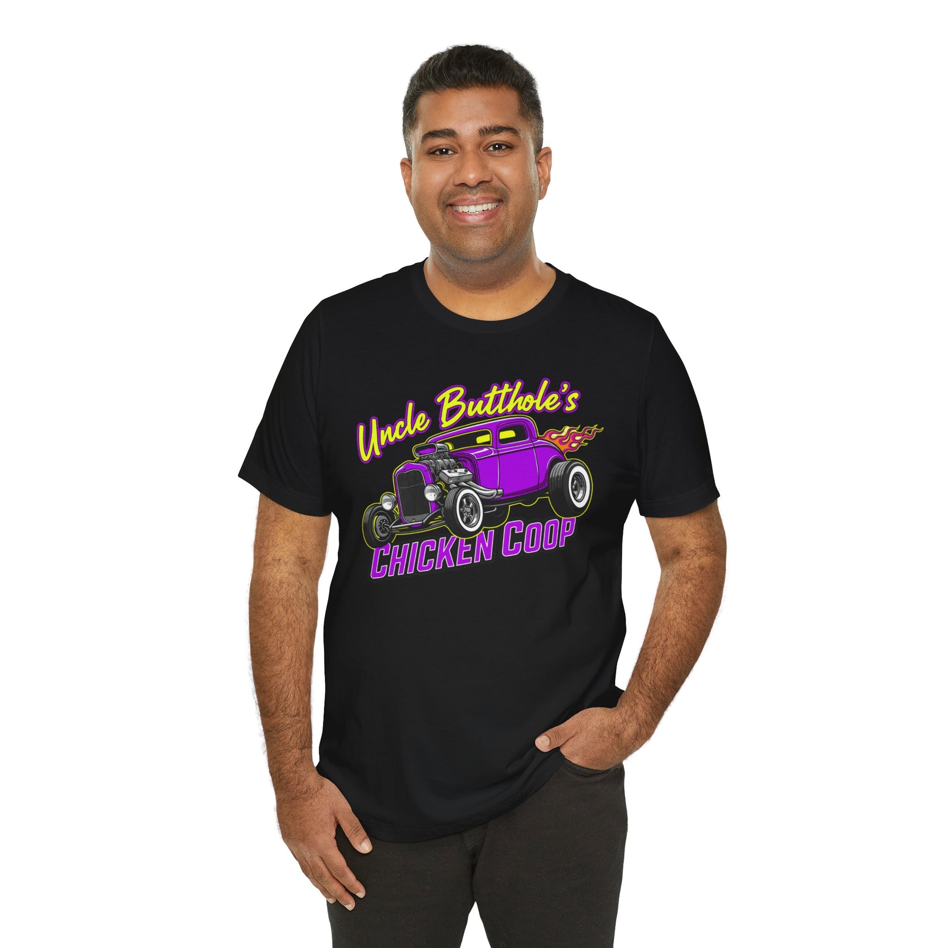 Man wearing a black Bella+Canvas 3001 t-shirt with purple hot rod graphic and text 'Uncle Butthole's Chicken Coop' on a white background