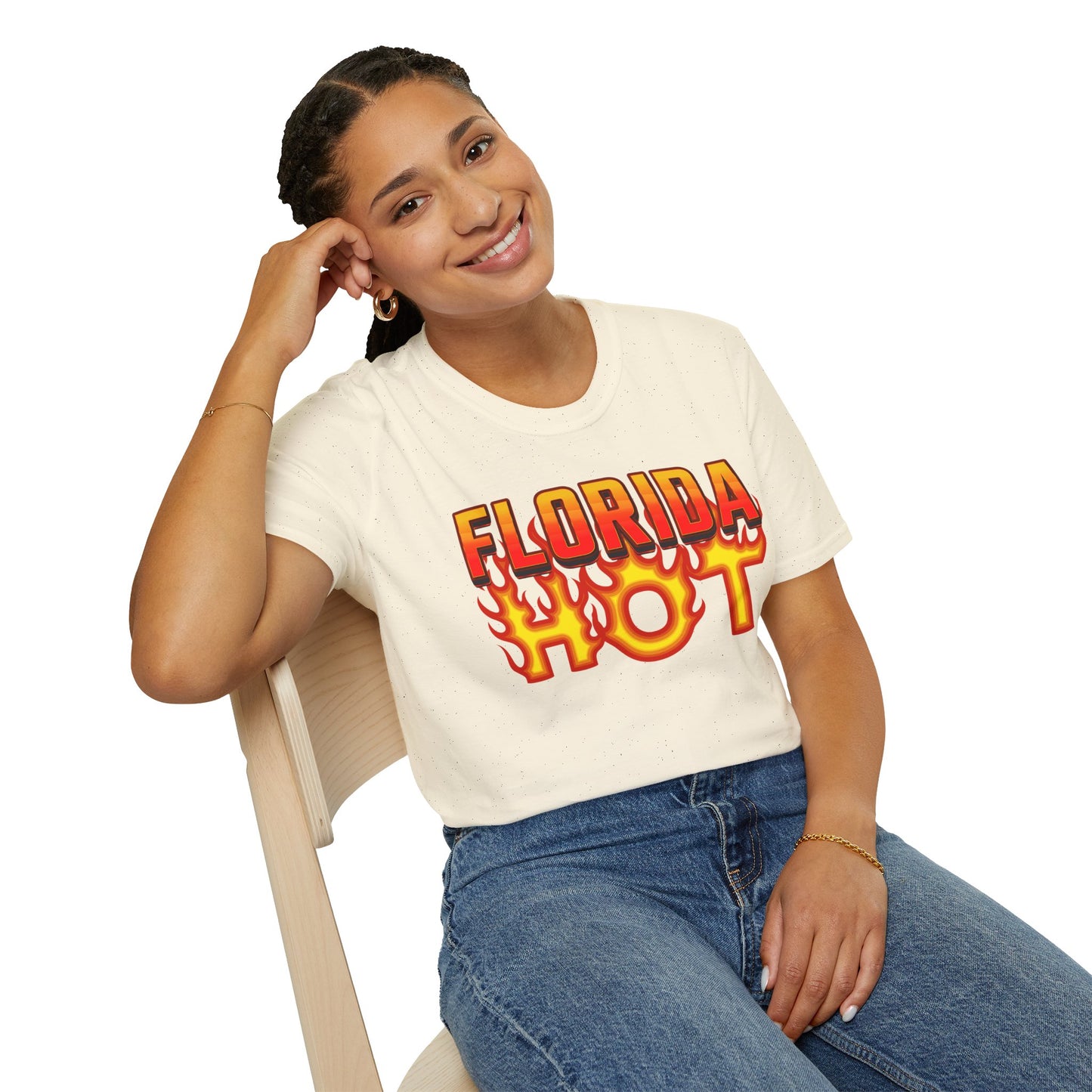 Person wearing a 'Florida Hot' t-shirt sitting on a chair with a white background