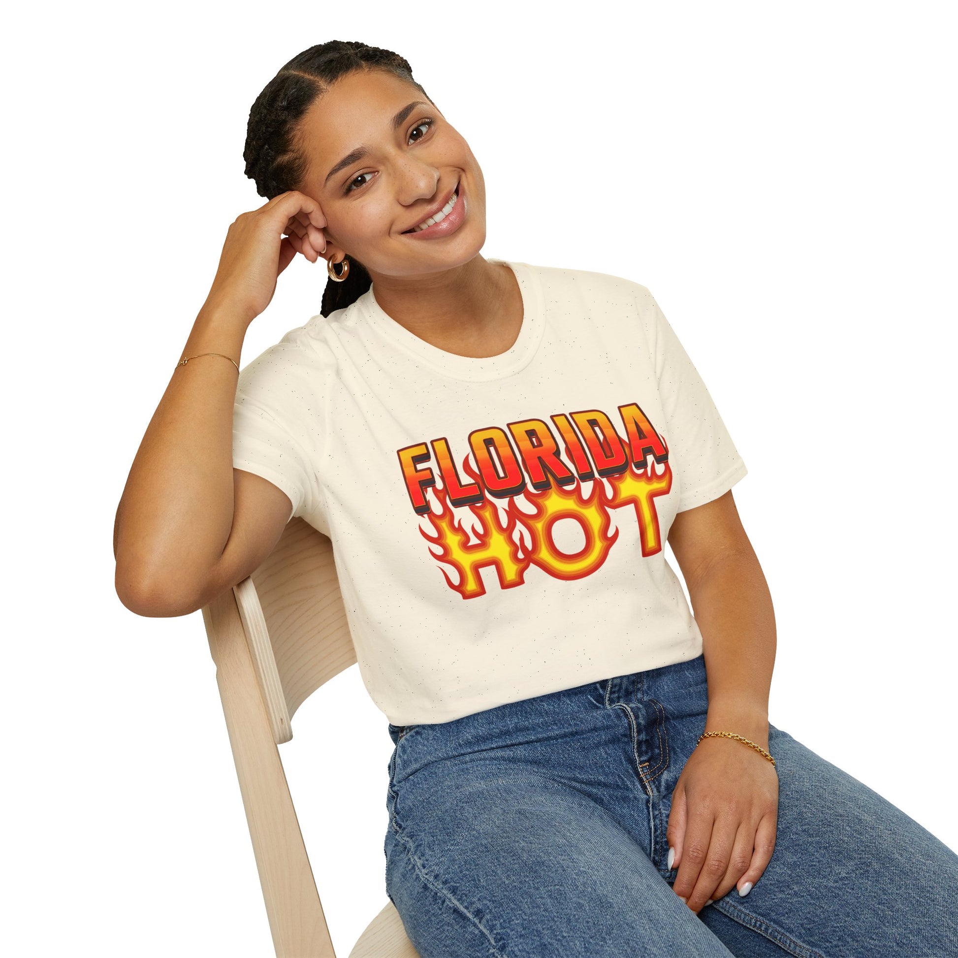 Person wearing a 'Florida Hot' t-shirt sitting on a chair with a white background