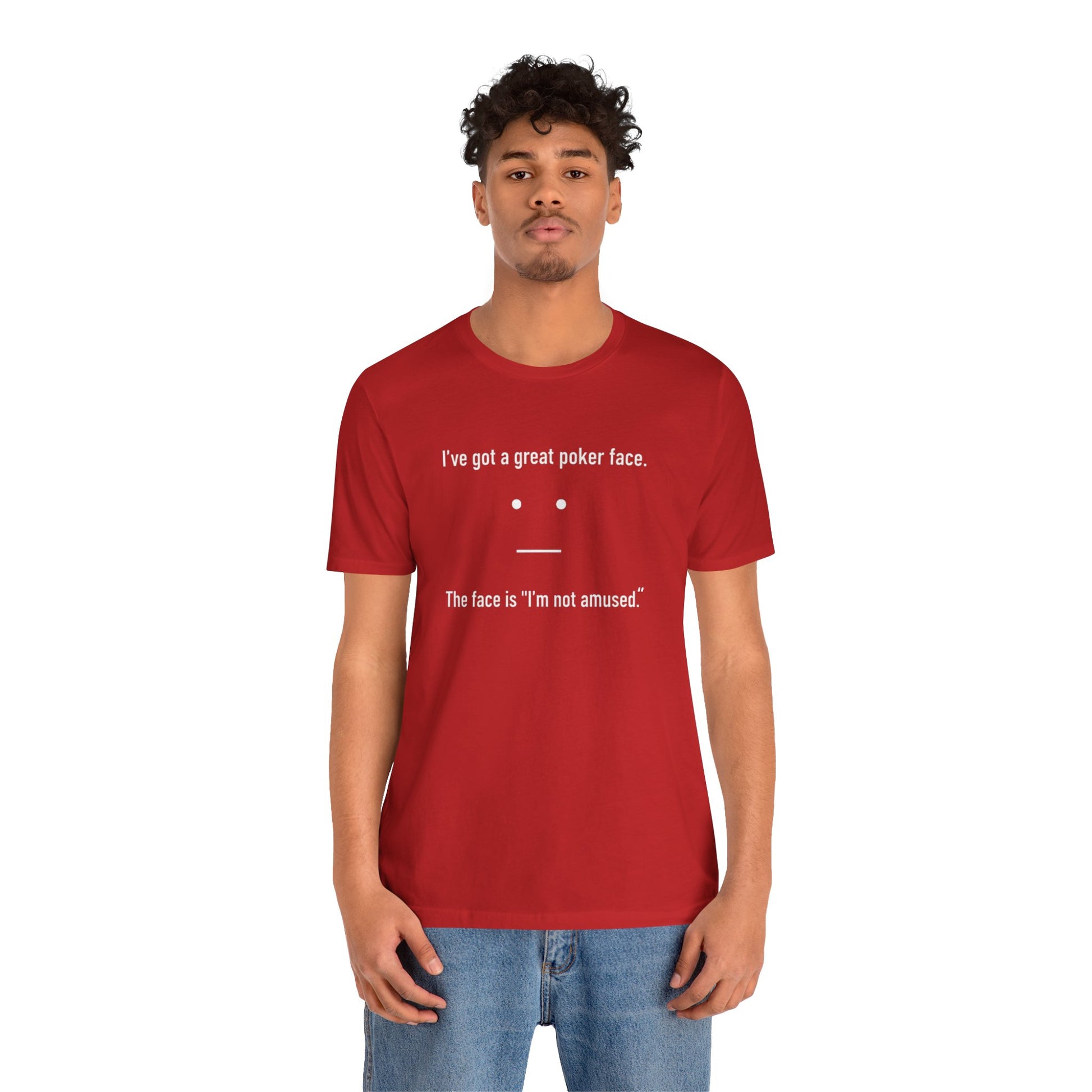 Person wearing a red t-shirt with text 'I've got a great poker face. The face is I'm not amused.' and a face graphic on a white background