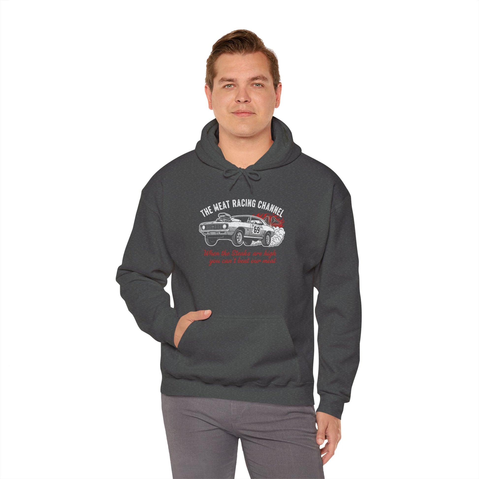 Man wearing a dark gray hoodie with a graphic design 'The Meat Racing Channel When the Steaks are high you can't beat our meat' on a white background
