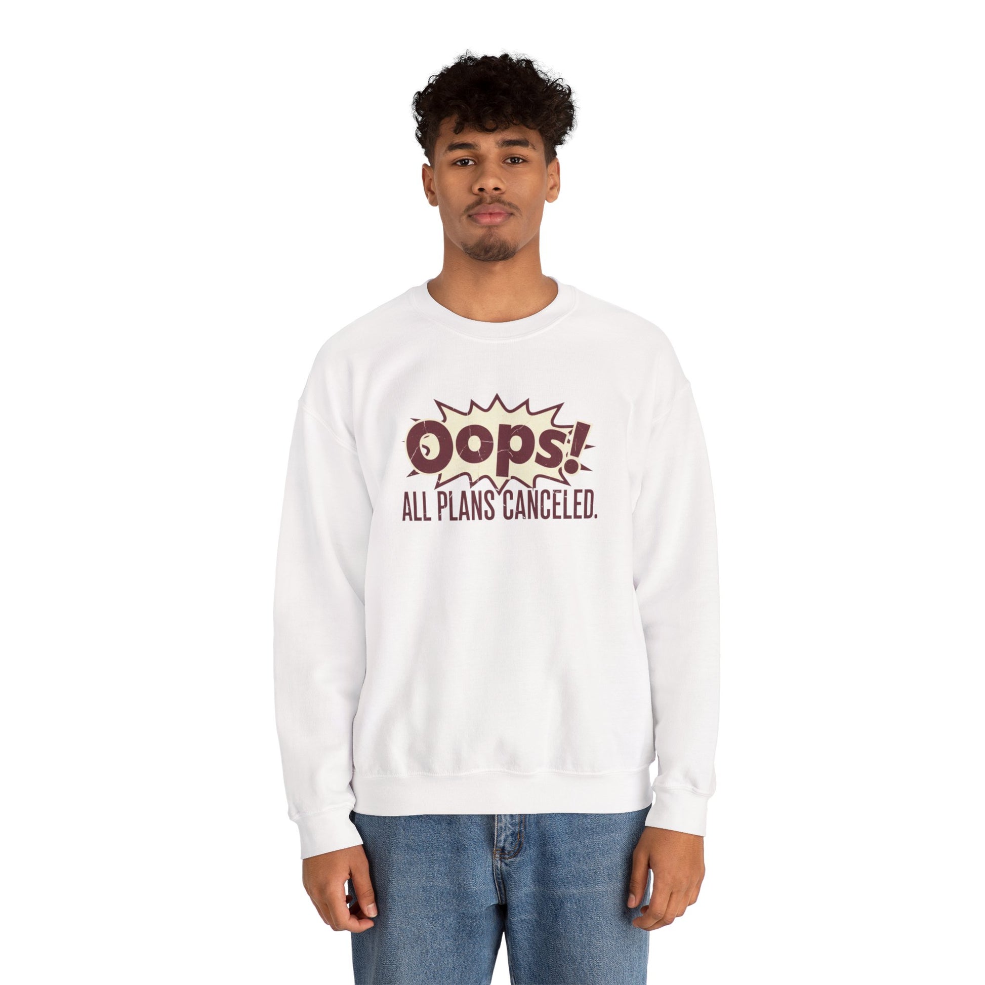 Person wearing a white sweatshirt with 'Oops! All Plans Canceled' text on a white background
