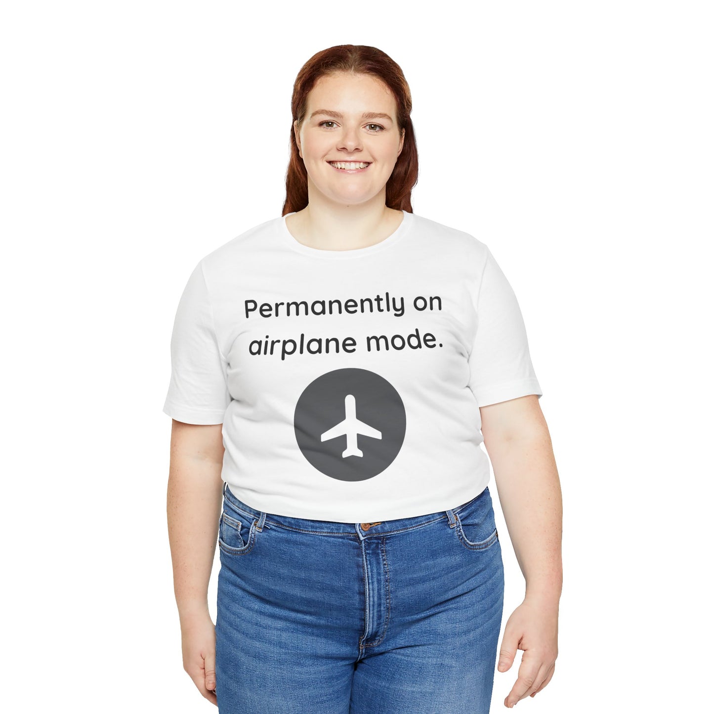 Person wearing a white t-shirt with text 'Permanently on airplane mode' and an airplane icon on a white background
