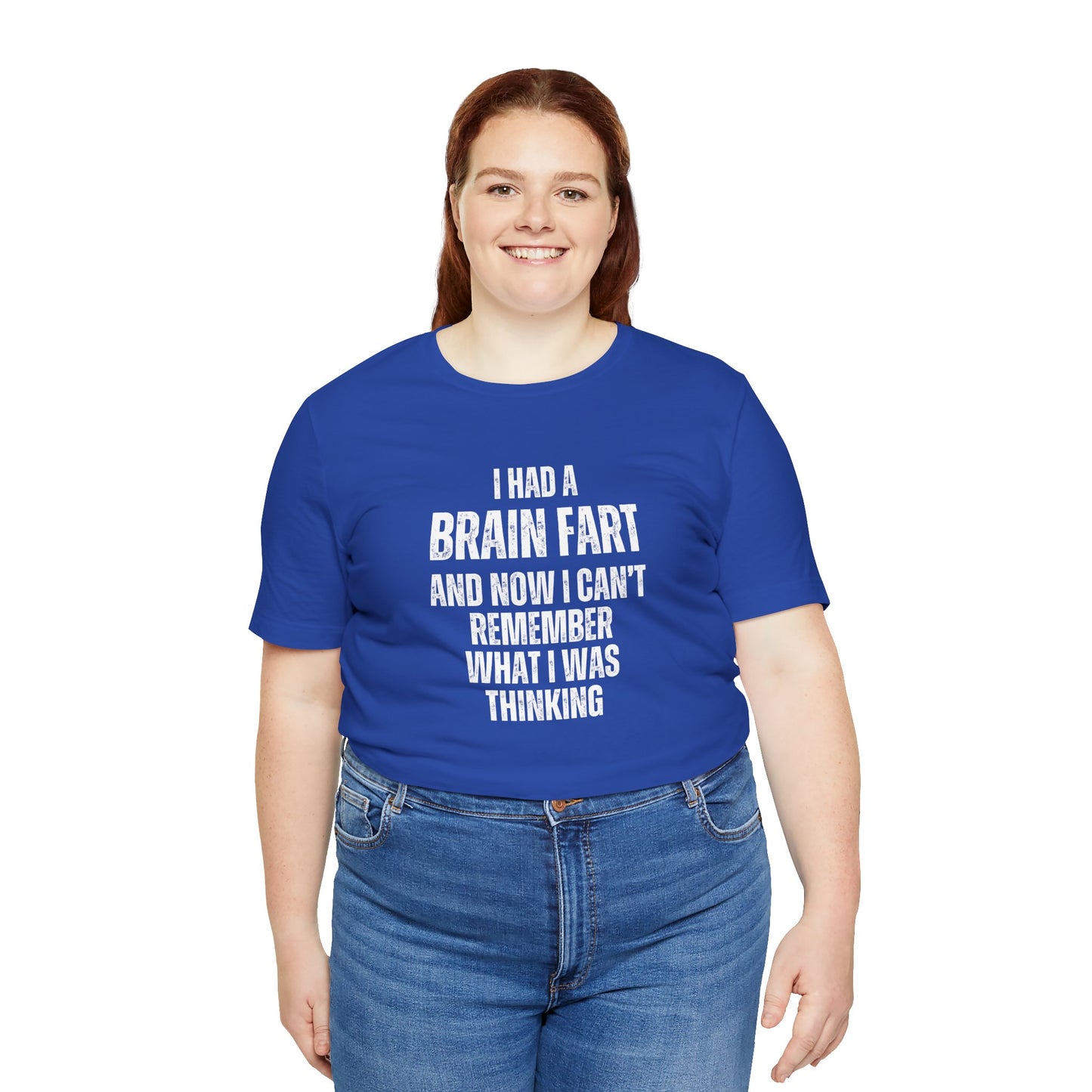 Person wearing a blue t-shirt with humorous text 'I had a brain fart and now I can't remember what I was thinking' on a white background