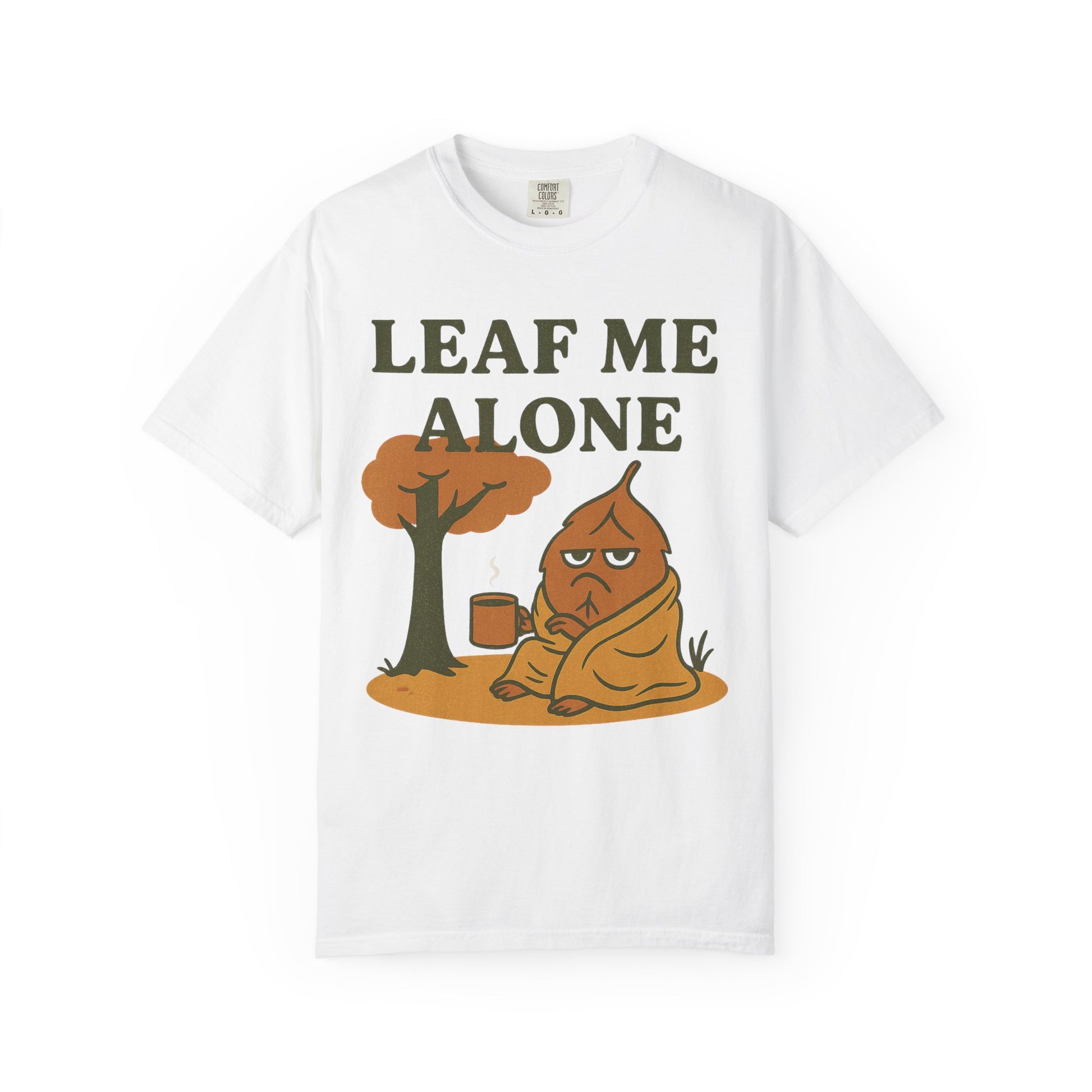 White t-shirt with a graphic of a tree and a character sitting under it, with text 'LEAF ME ALONE' on a white background.