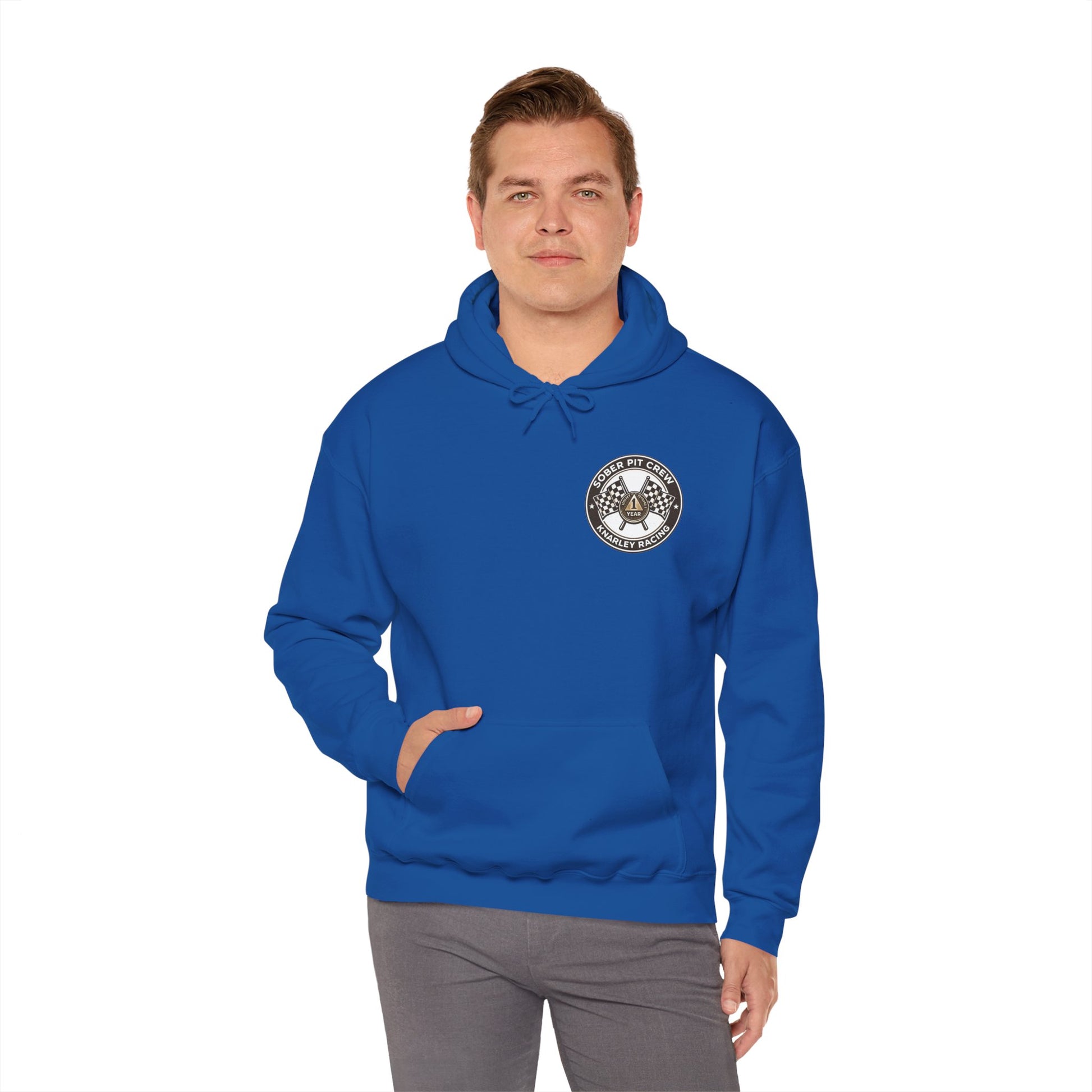 Man wearing a blue hoodie with a 'Sober Pit Crew Knarley Racing' logo on a white background