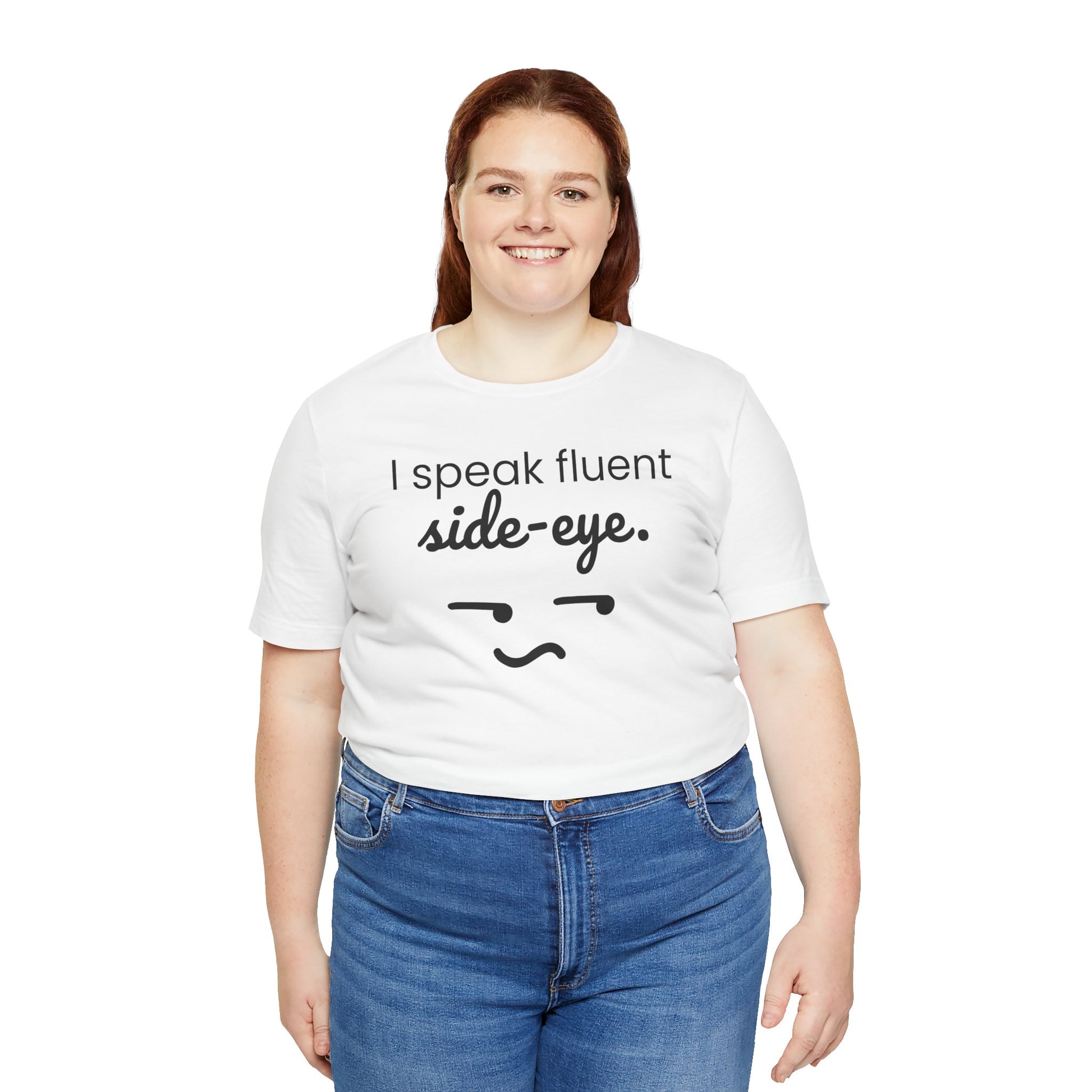 Person wearing a white t-shirt with text 'I speak fluent side eye' and a graphic, standing against a white background