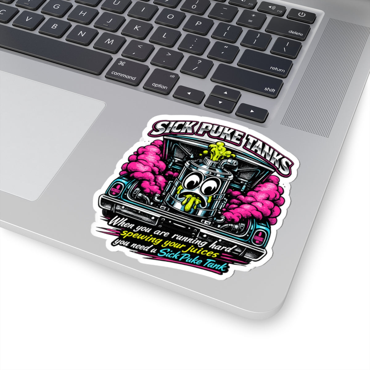 A colorful “Sick Puke Tank” kiss‑cut sticker featuring a bold, cartoon‑style engine puke tank with neon accents and playful lettering. The design has a bright, high‑contrast motorsport aesthetic and a clean white border around the edges, placed on a laptop hand rest