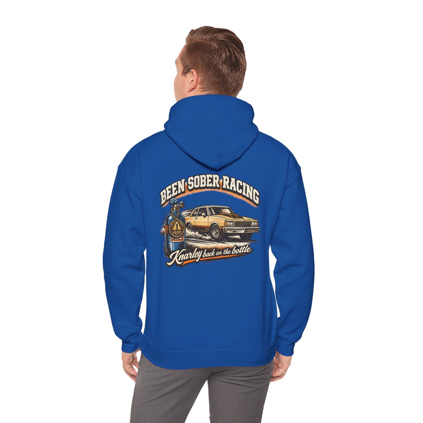 Blue hoodie with graphic design and 'Been Sober Racing Knarley back on the bottle' text on the back worn by a person, on a white background