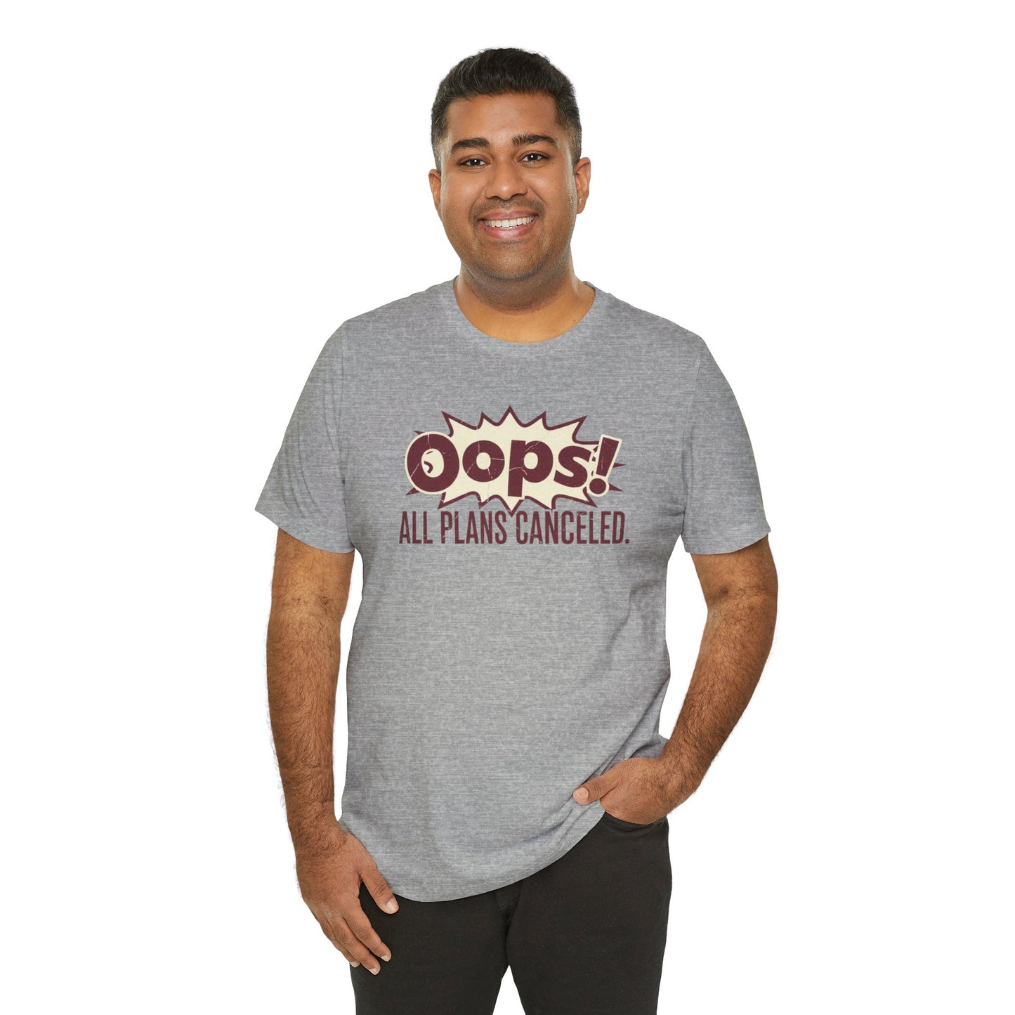 Man wearing a gray t-shirt with 'Oops! All Plans Canceled' text on a white background