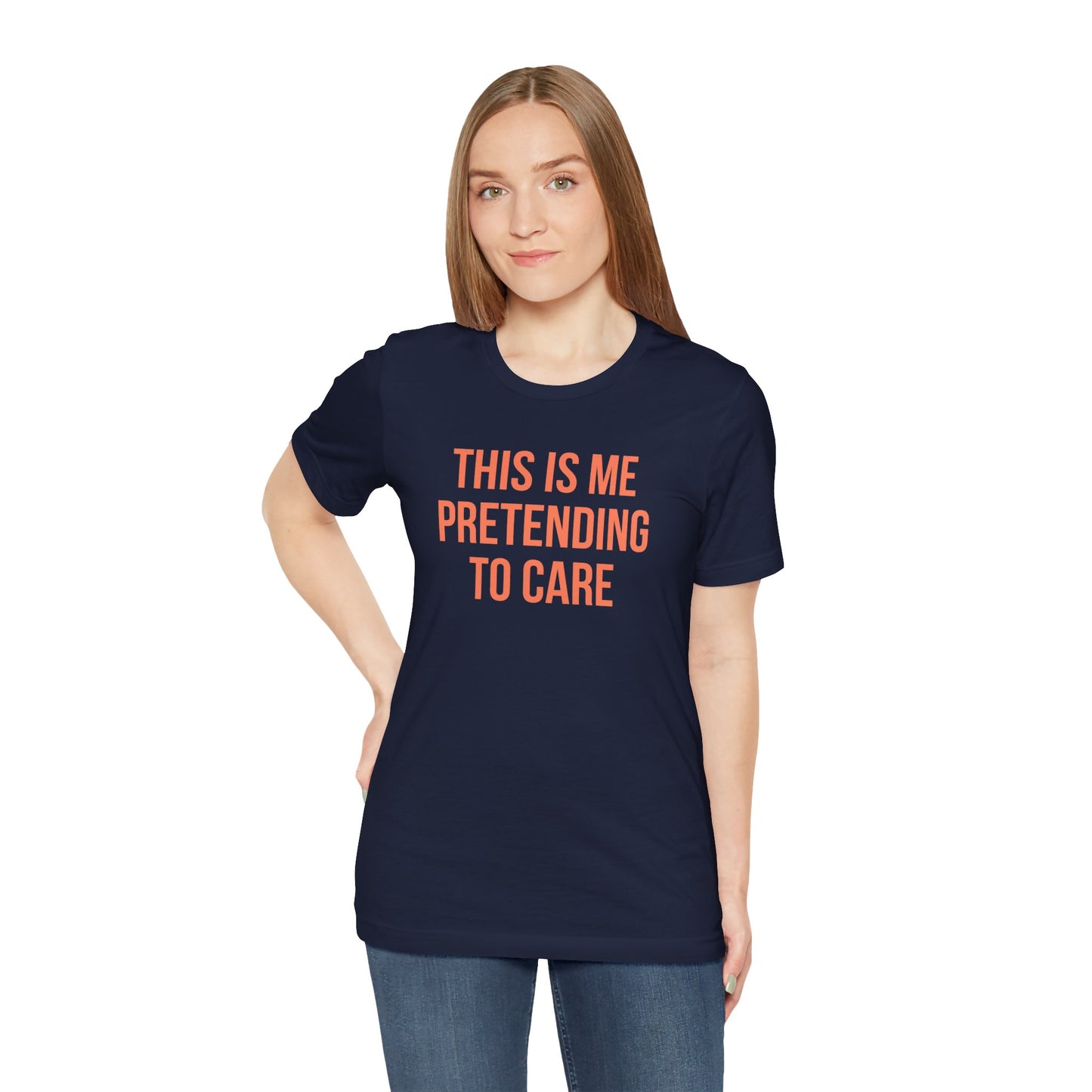 Person wearing a navy blue t-shirt with red text 'This is me pretending to care' on a white background