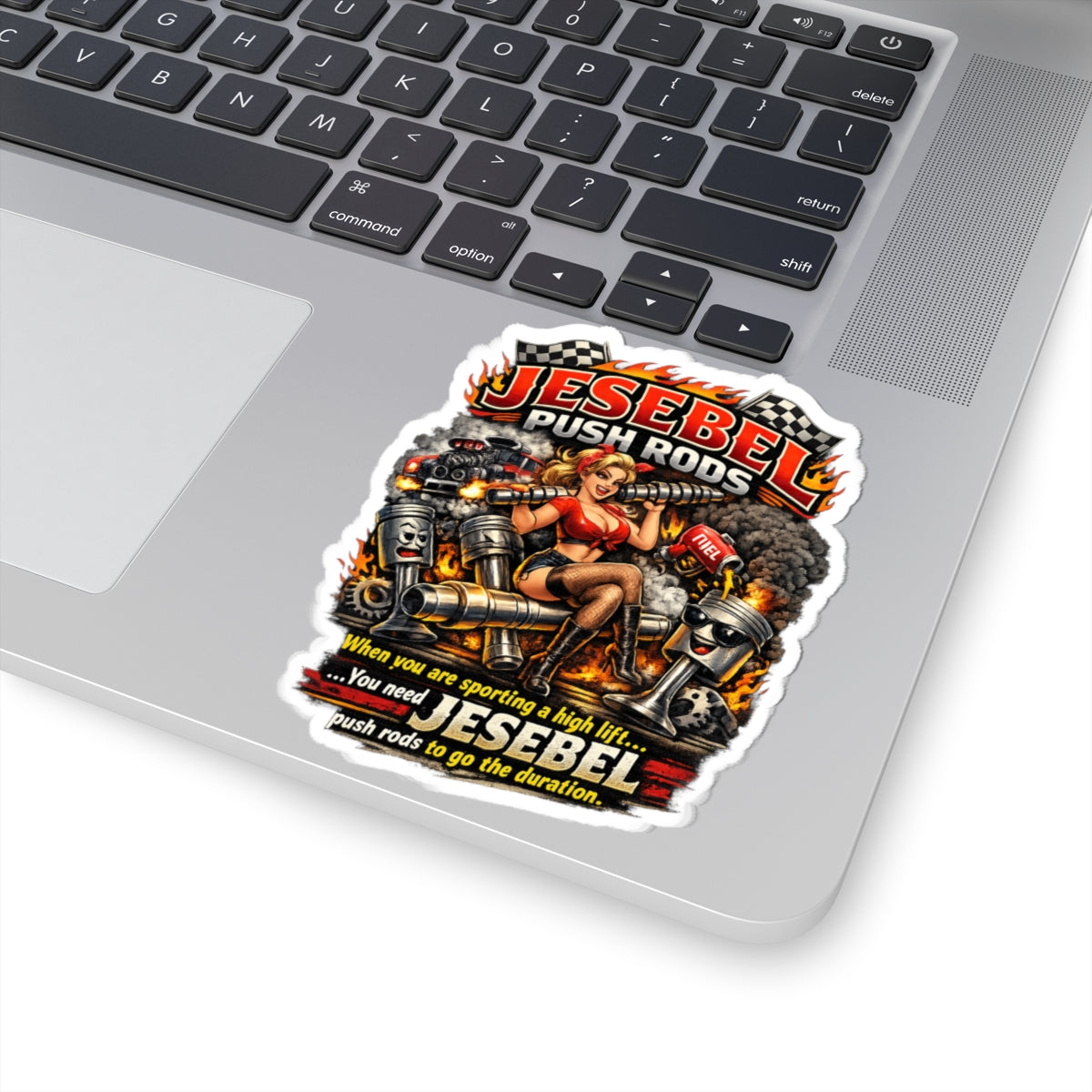 Sticker with 'Jesabel Push Rods' design on a laptop keyboard