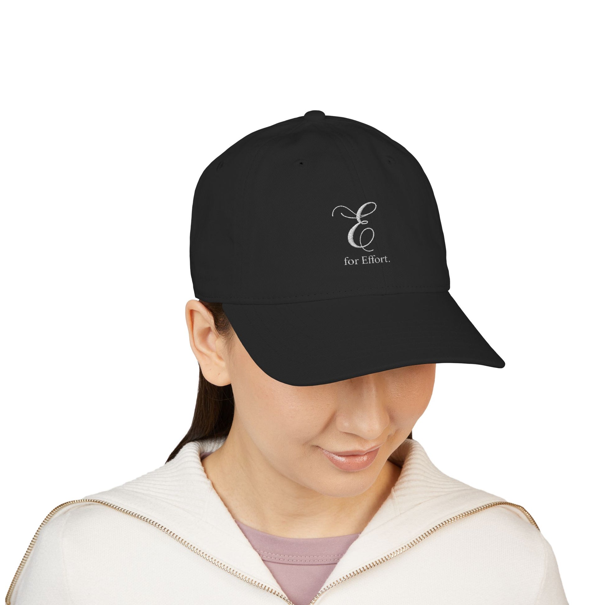 Black cap with 'E for Effort' logo worn by a person on a white background
