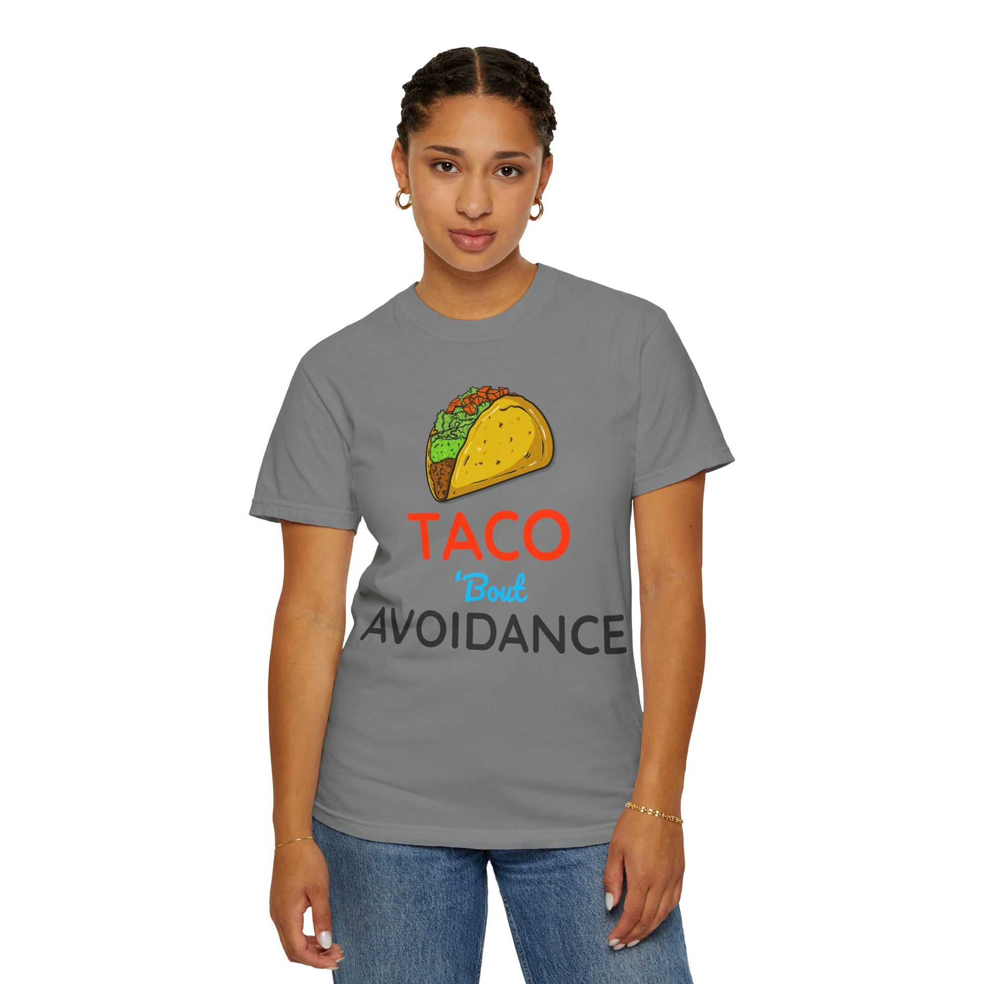 Person wearing a gray t-shirt with a taco graphic and text 'Taco 'bout avoidance' on a white background