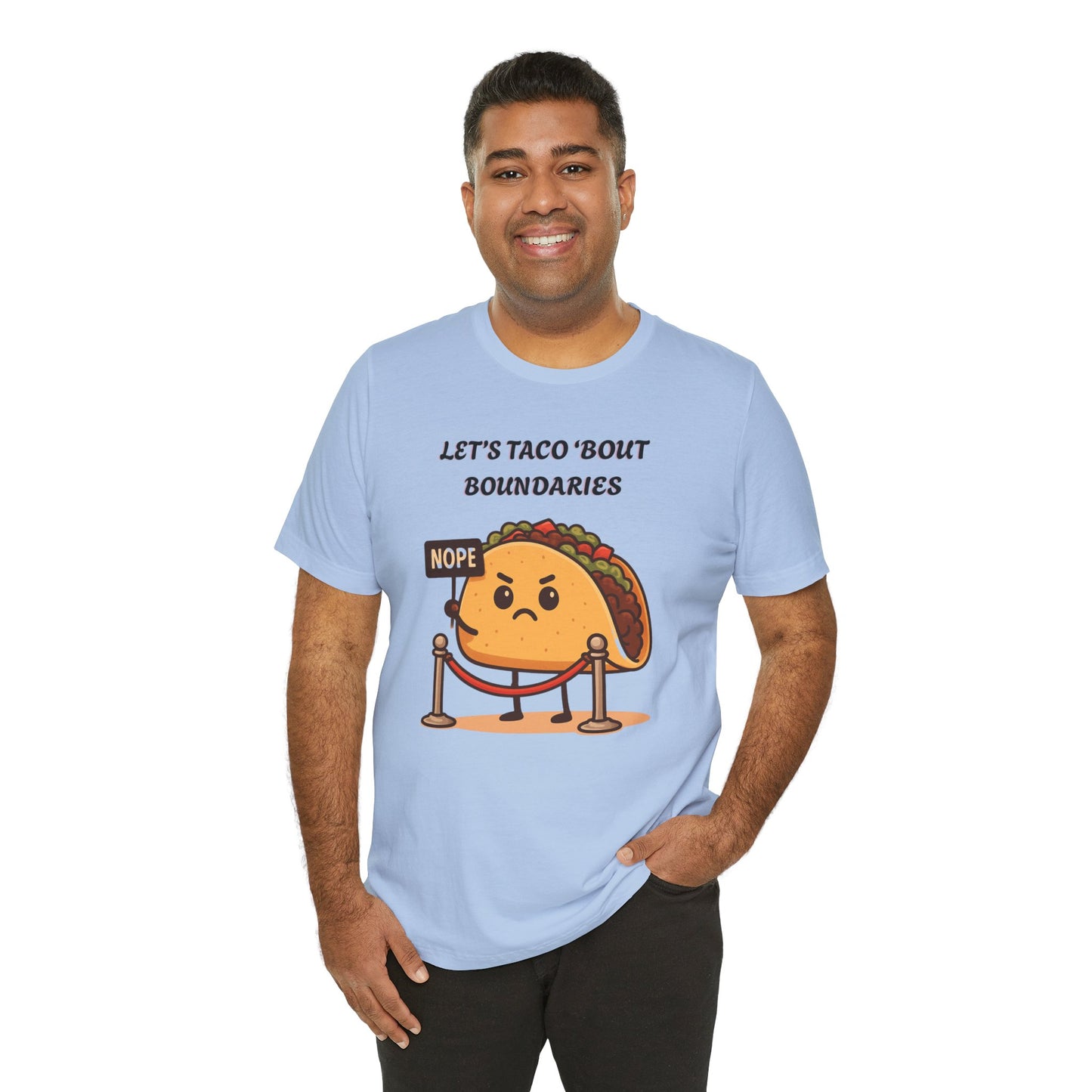 Man wearing a light blue t-shirt with a cartoon taco graphic and text 'Let's taco 'bout boundaries', on a white background