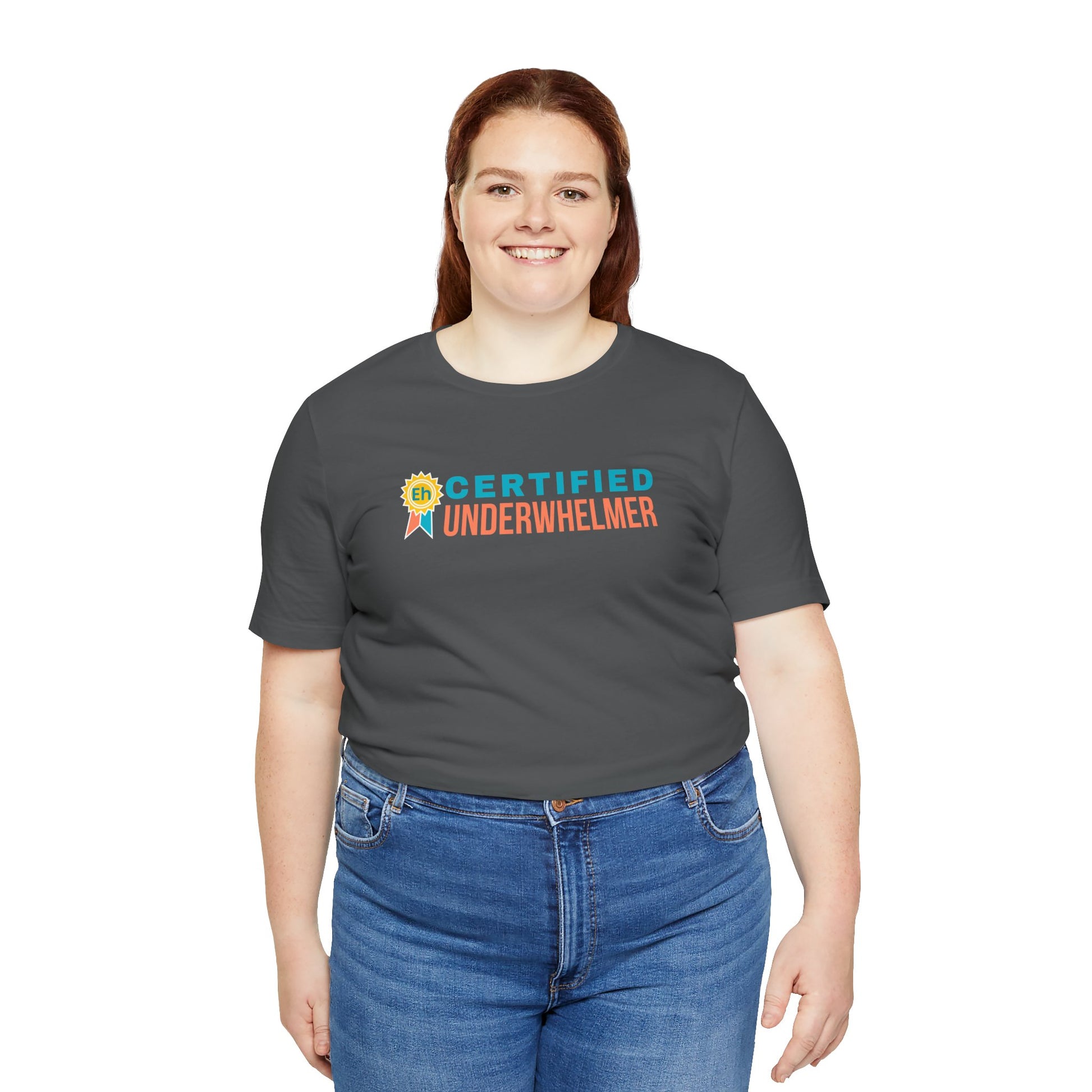 Person wearing a gray t-shirt with 'Certified Underwhelmer' text on a white background