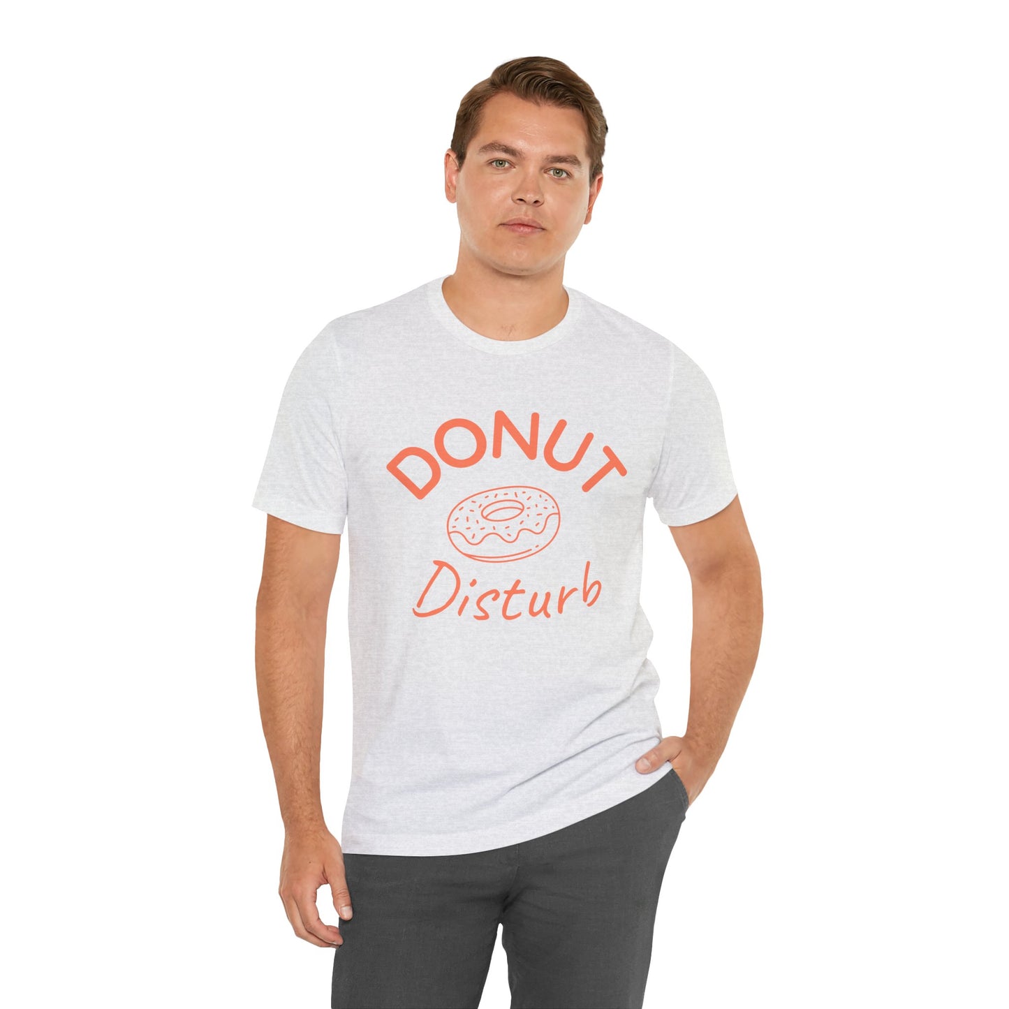 Man wearing a white t-shirt with 'DONUT Disturb' text and donut graphic on a white background
