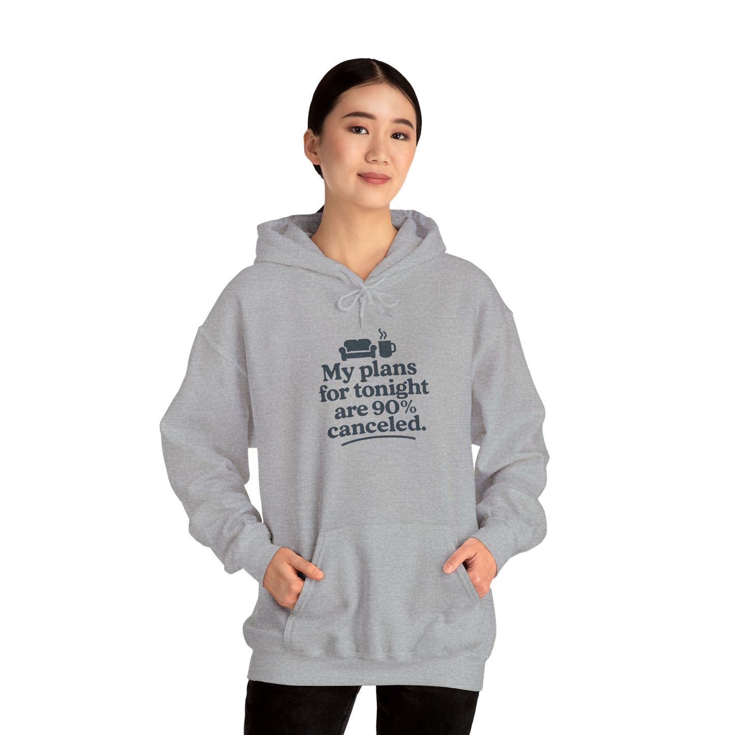 Person wearing a gray hoodie with text 'My plans for tonight are 90% canceled' on a white background