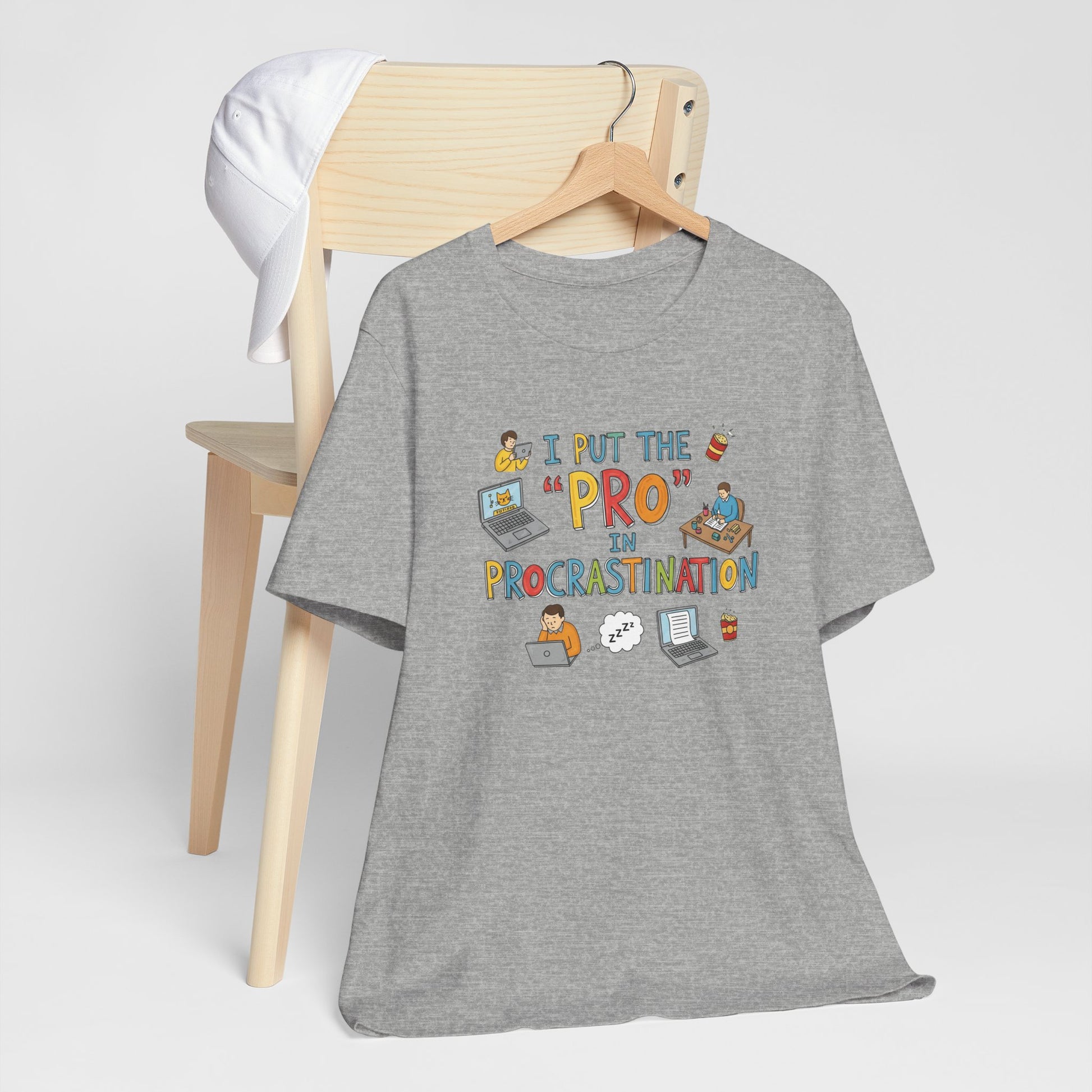 Gray t-shirt with colorful graphic and text on a wooden hanger against a white background