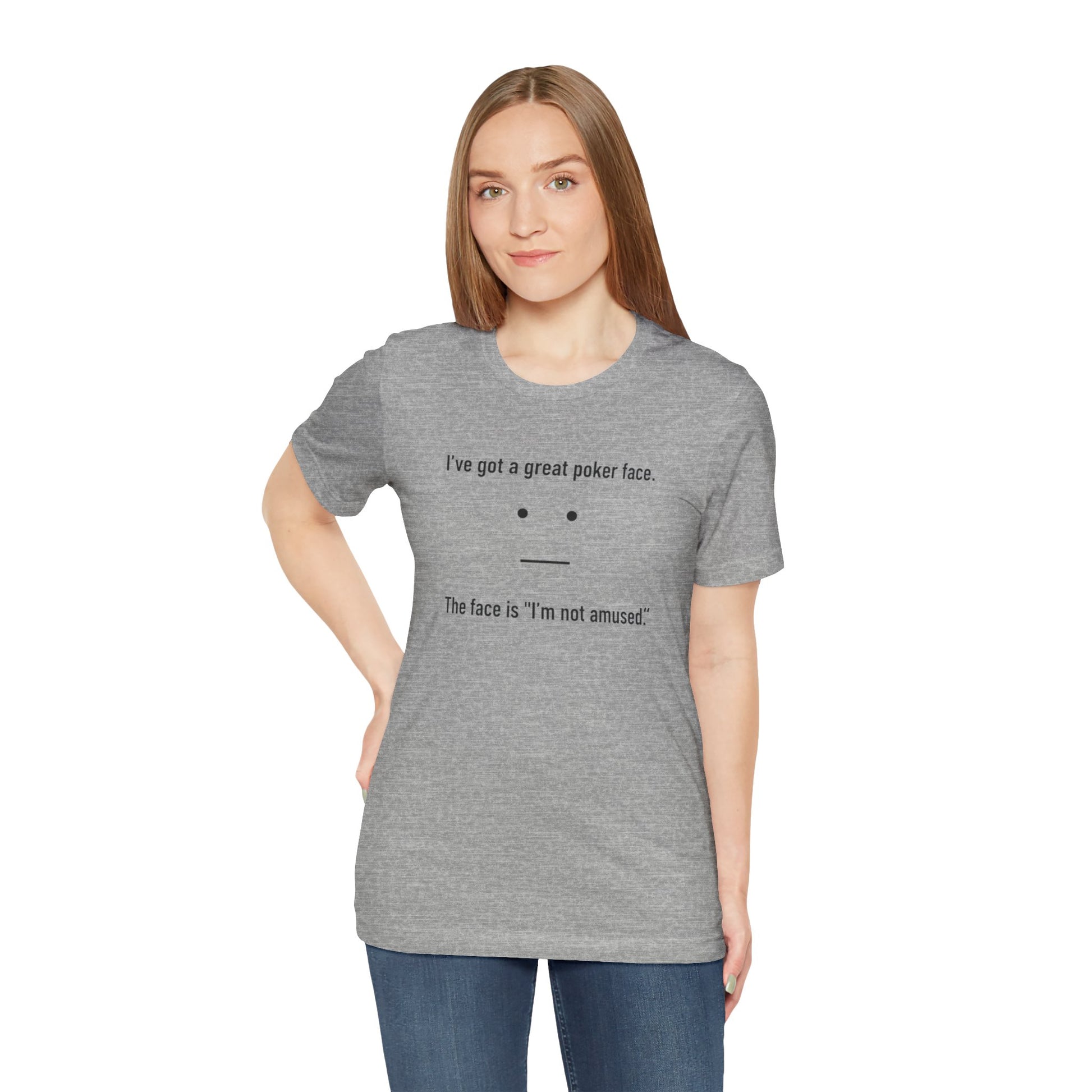Woman wearing a gray t-shirt with text 'I've got a great poker face. The face is I'm not amused.' and a face graphic on a white background