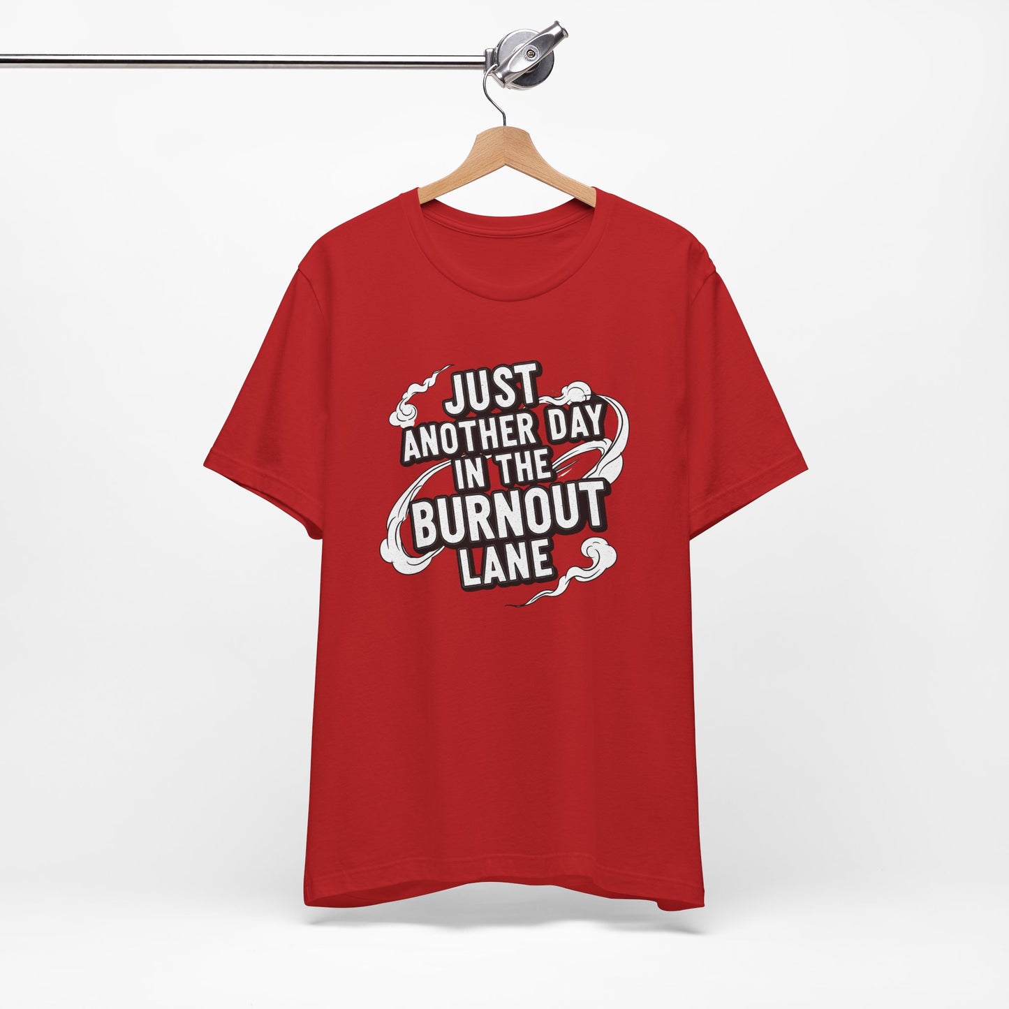 Red t-shirt with text 'Just another day in the burnout lane' on a hanger against a white background