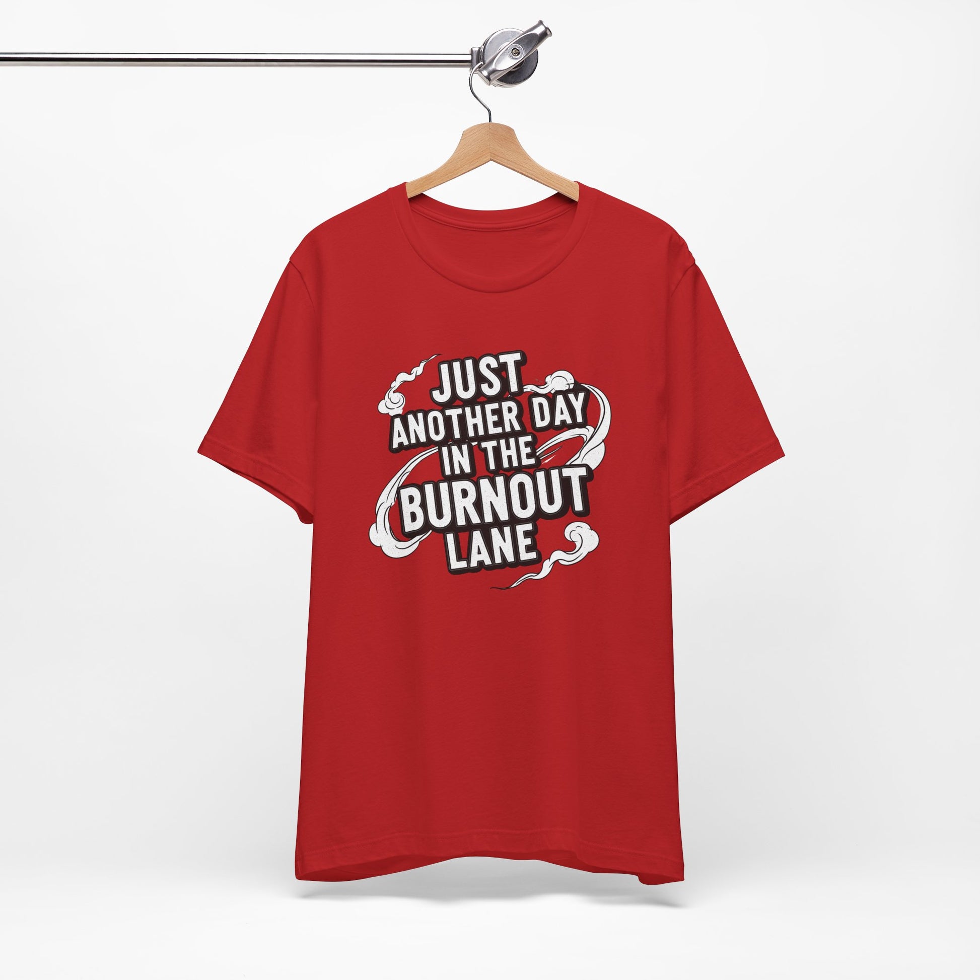 Red t-shirt with text 'Just another day in the burnout lane' on a hanger against a white background