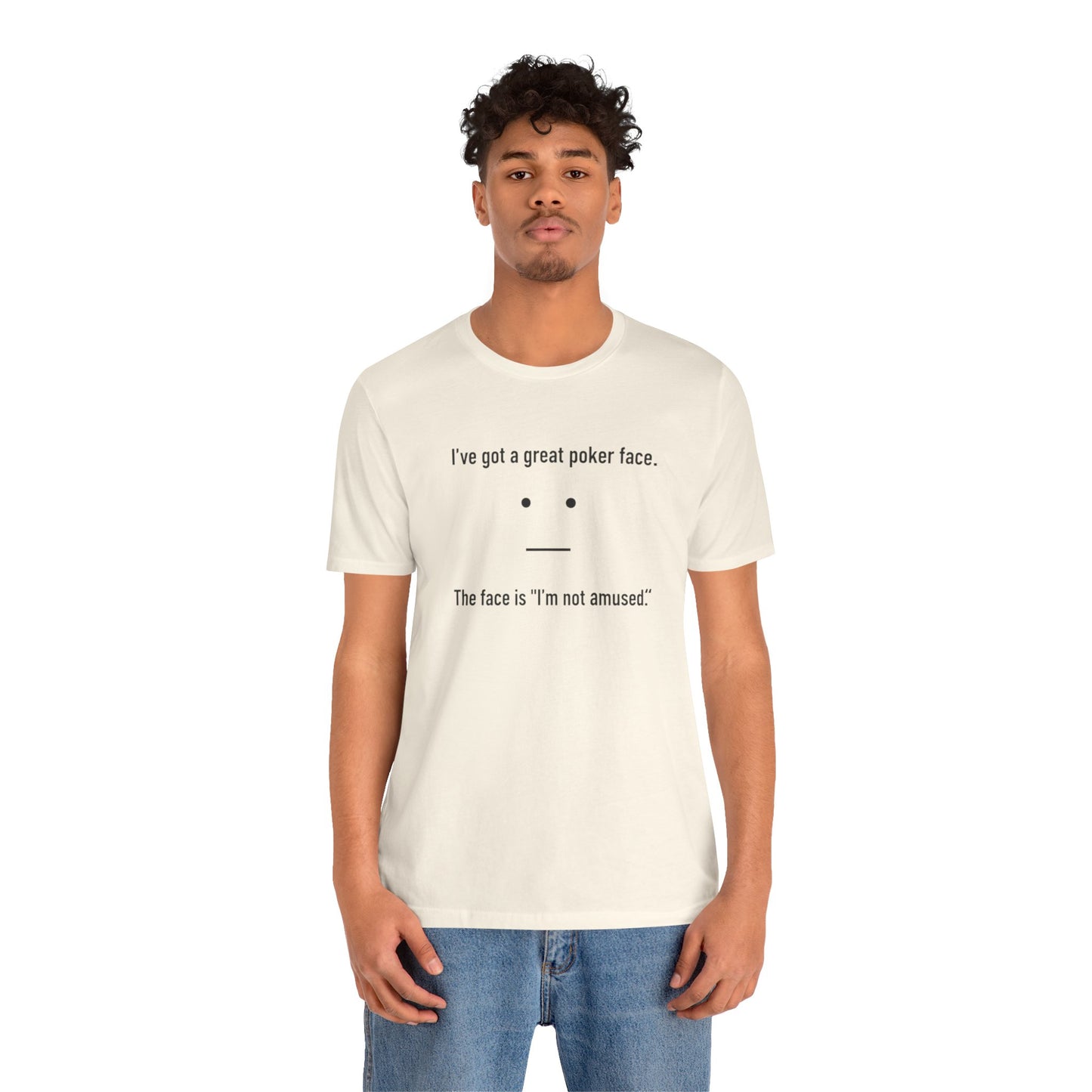 Person wearing a natural t-shirt with text 'I've got a great poker face. The face is I'm not amused.' and a face graphic on a white background