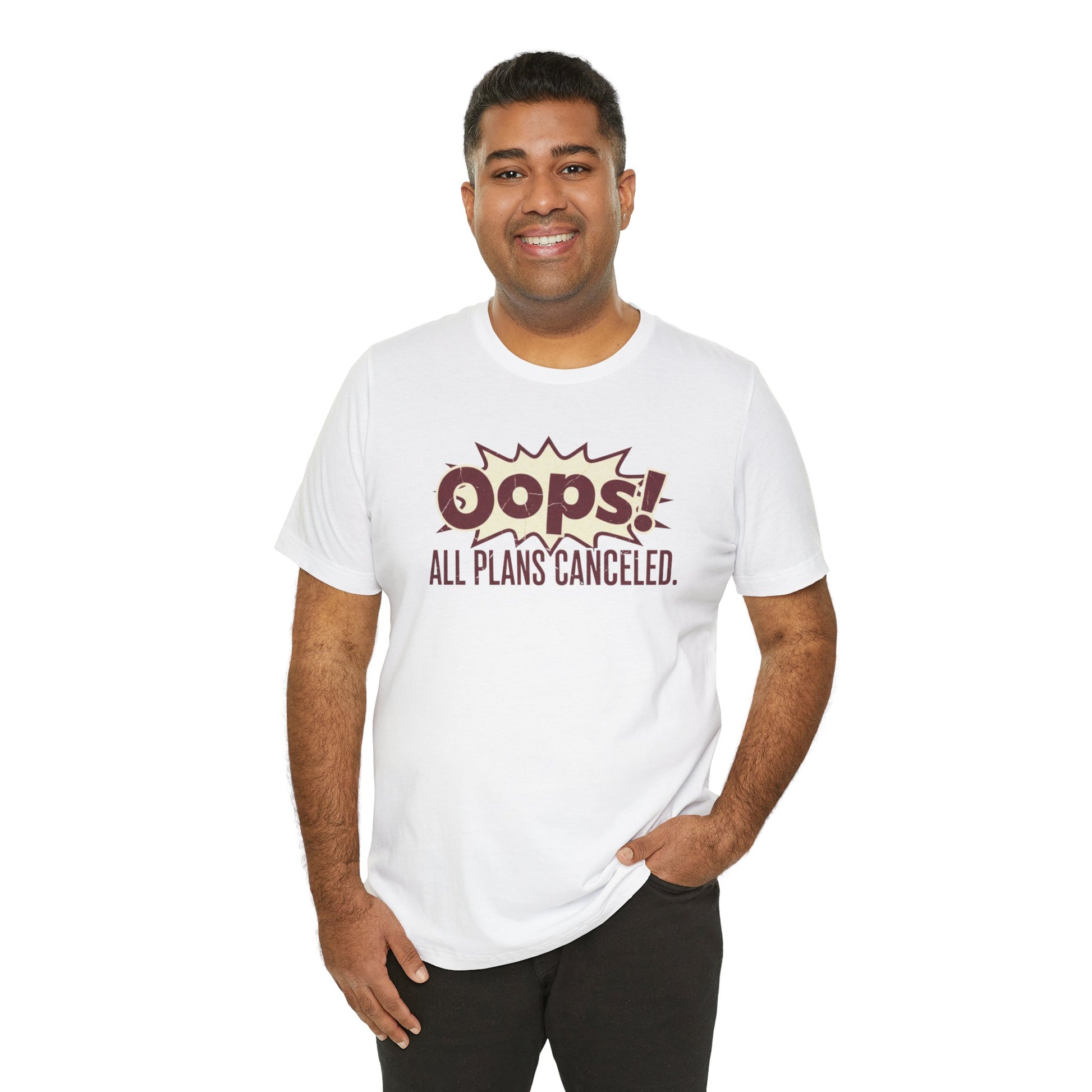 Man wearing a white t-shirt with 'Oops! All plans canceled.' text on a white background