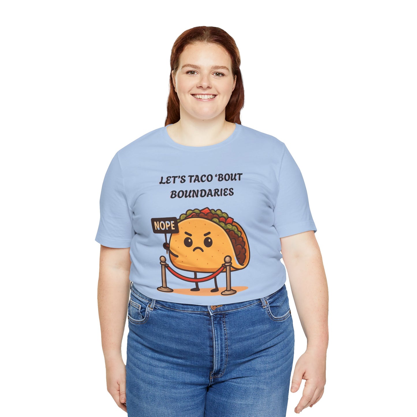 Person wearing a light blue t-shirt with a taco graphic and text 'Let's taco 'bout boundaries', on a white background
