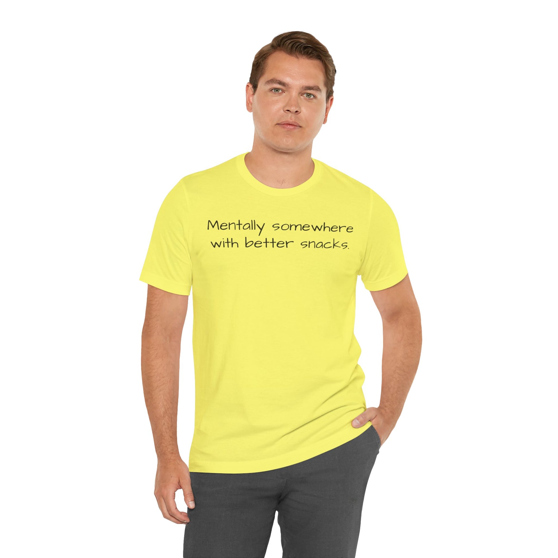 Man wearing a yellow t-shirt with text 'Mentally somewhere with better snacks' on a white background