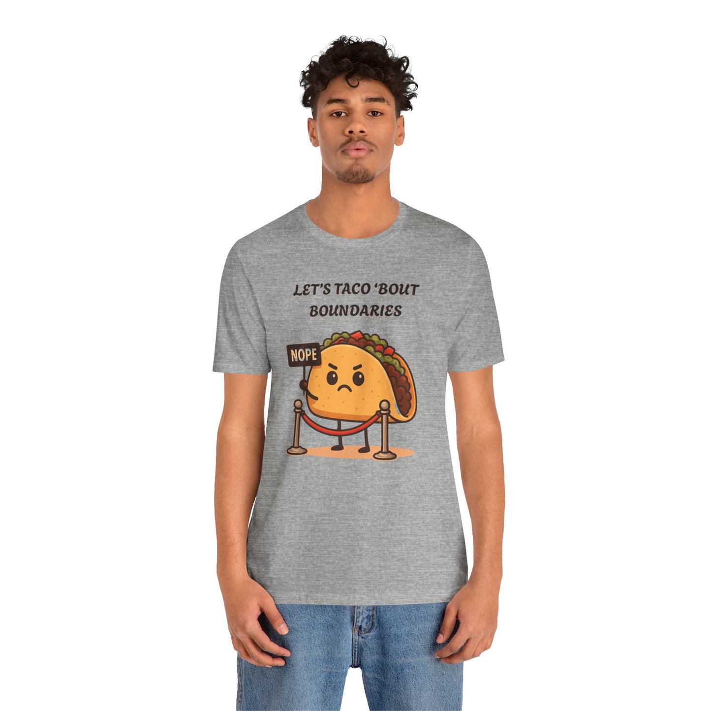 Person wearing a gray t-shirt with a taco graphic and text 'Let's taco 'bout boundaries', on a white background