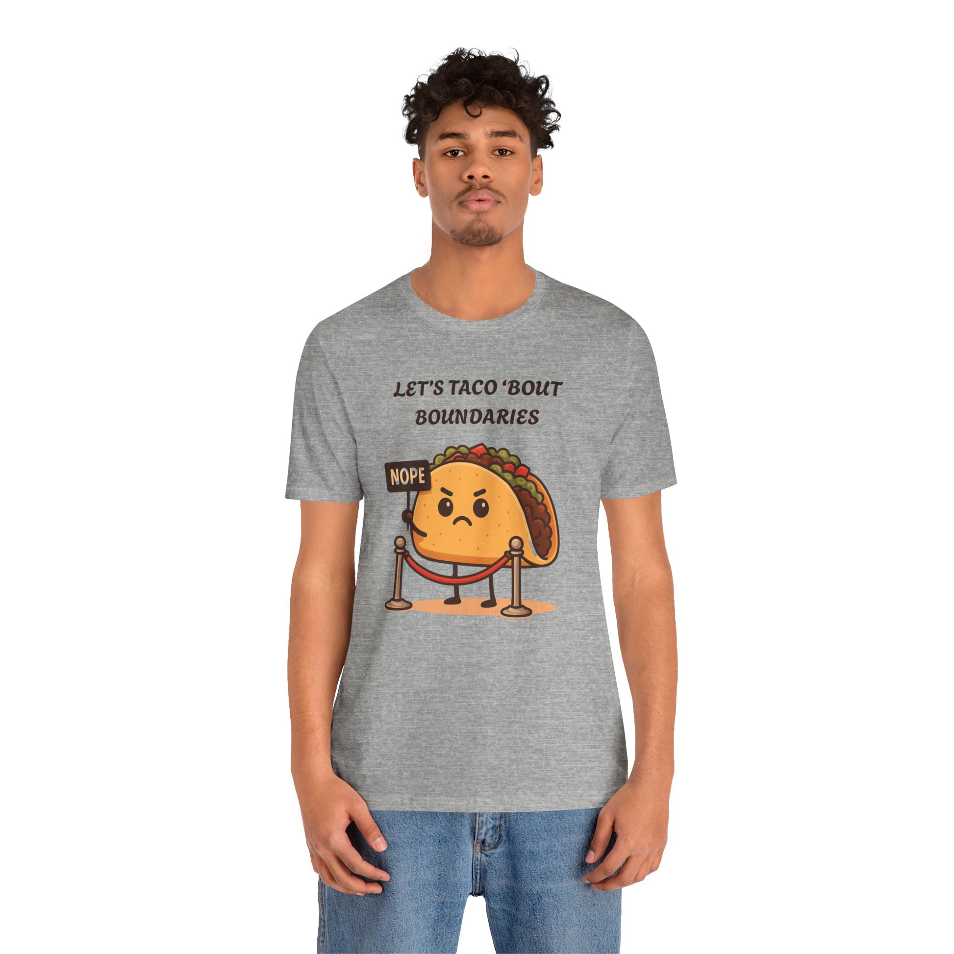 Person wearing a gray t-shirt with a taco graphic and text 'Let's taco 'bout boundaries', on a white background