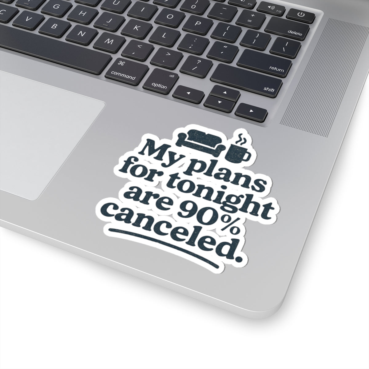 Laptop with a sticker reading 'My plans for tonight are 90% canceled.' on a white background