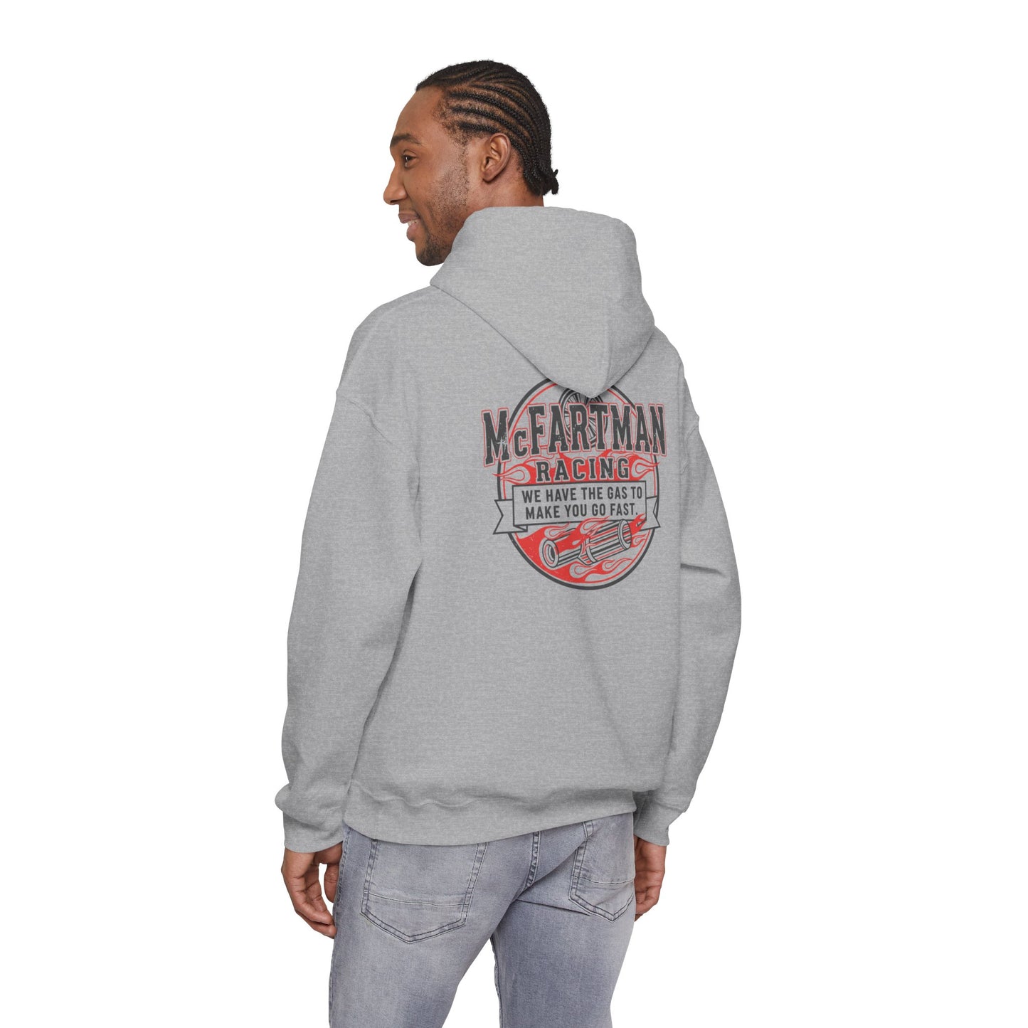 Person wearing a gray hoodie with a red and black graphic McFartman Racing We have the gas to make you go fast on the back, on a white background