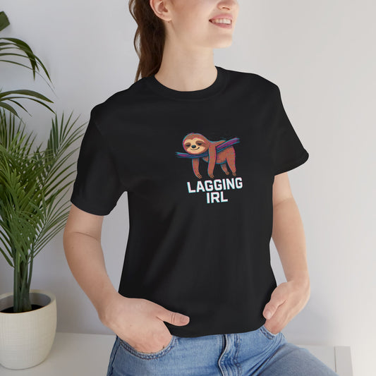 Person wearing a black t-shirt with a sloth graphic and text 'Lagging IRL', standing indoors.