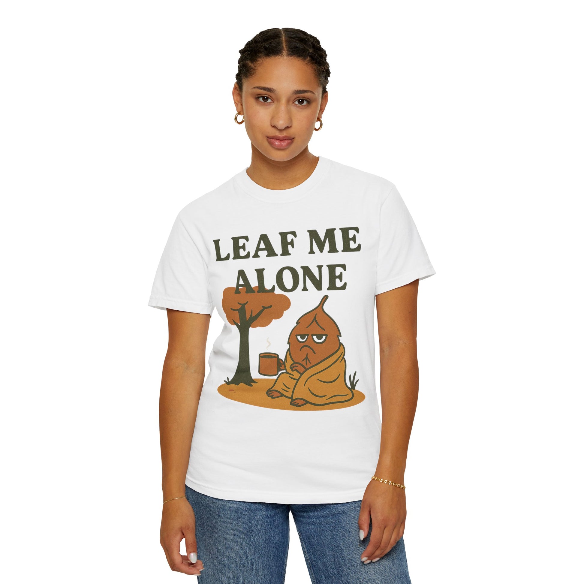 Person wearing a white t-shirt with a graphic design and text 'Leaf me alone' on a white background