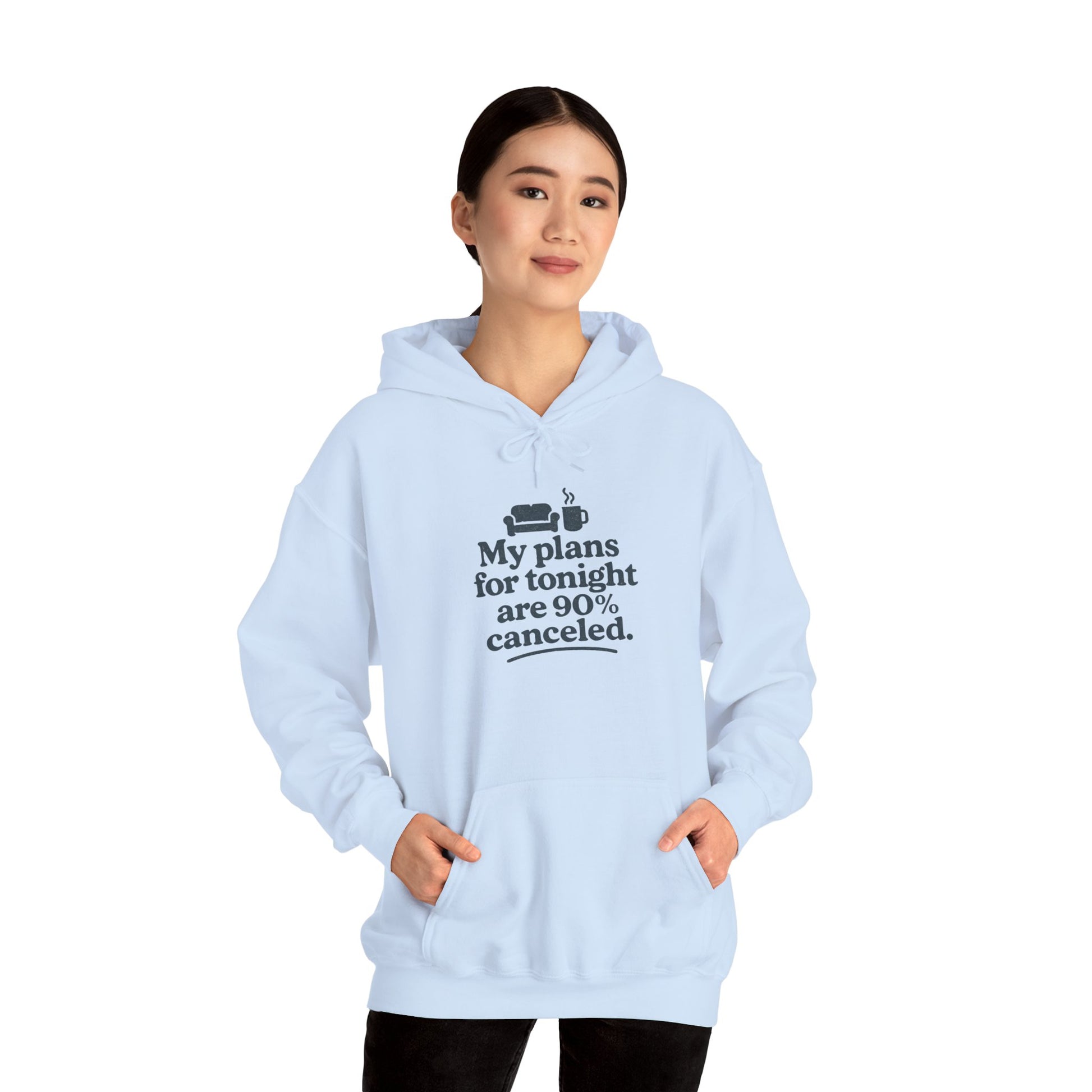 Light blue hoodie with text 'My plans for tonight are 90% canceled' worn by a person on a white background