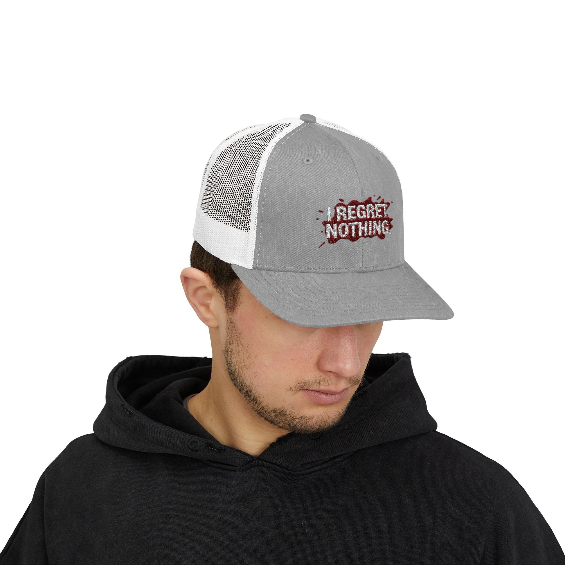 Person wearing a gray and white cap with 'I Regret Nothing' text on a white background