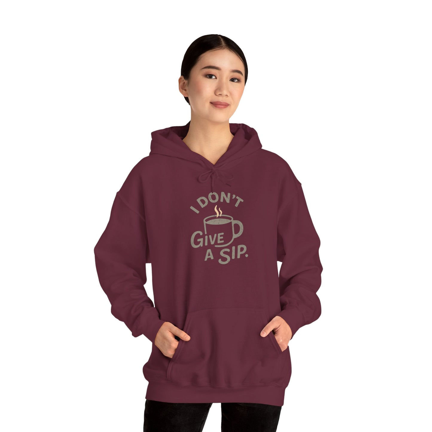 Person wearing a maroon hoodie with 'I don't give a sip' text and graphic on a white background