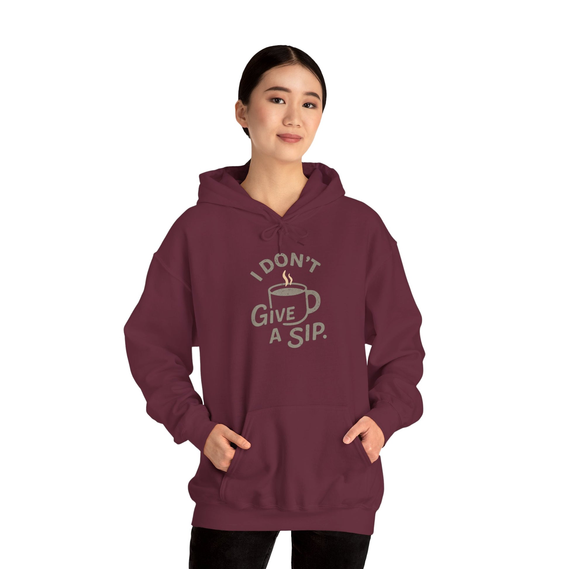 Person wearing a maroon hoodie with 'I don't give a sip' text and graphic on a white background