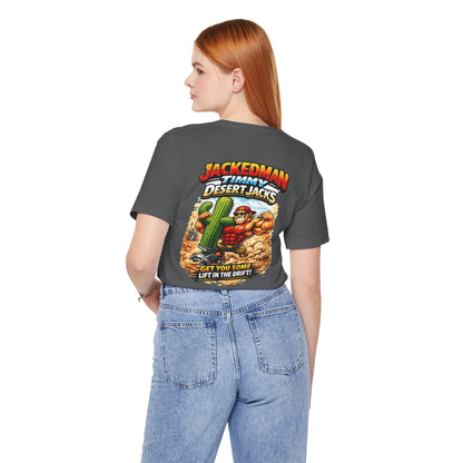 Person wearing a gray t-shirt with a graphic design and 'Jackedman Timmy Desert Jacks Get You Some Lift In The Drift' text on the back, standing against a white background