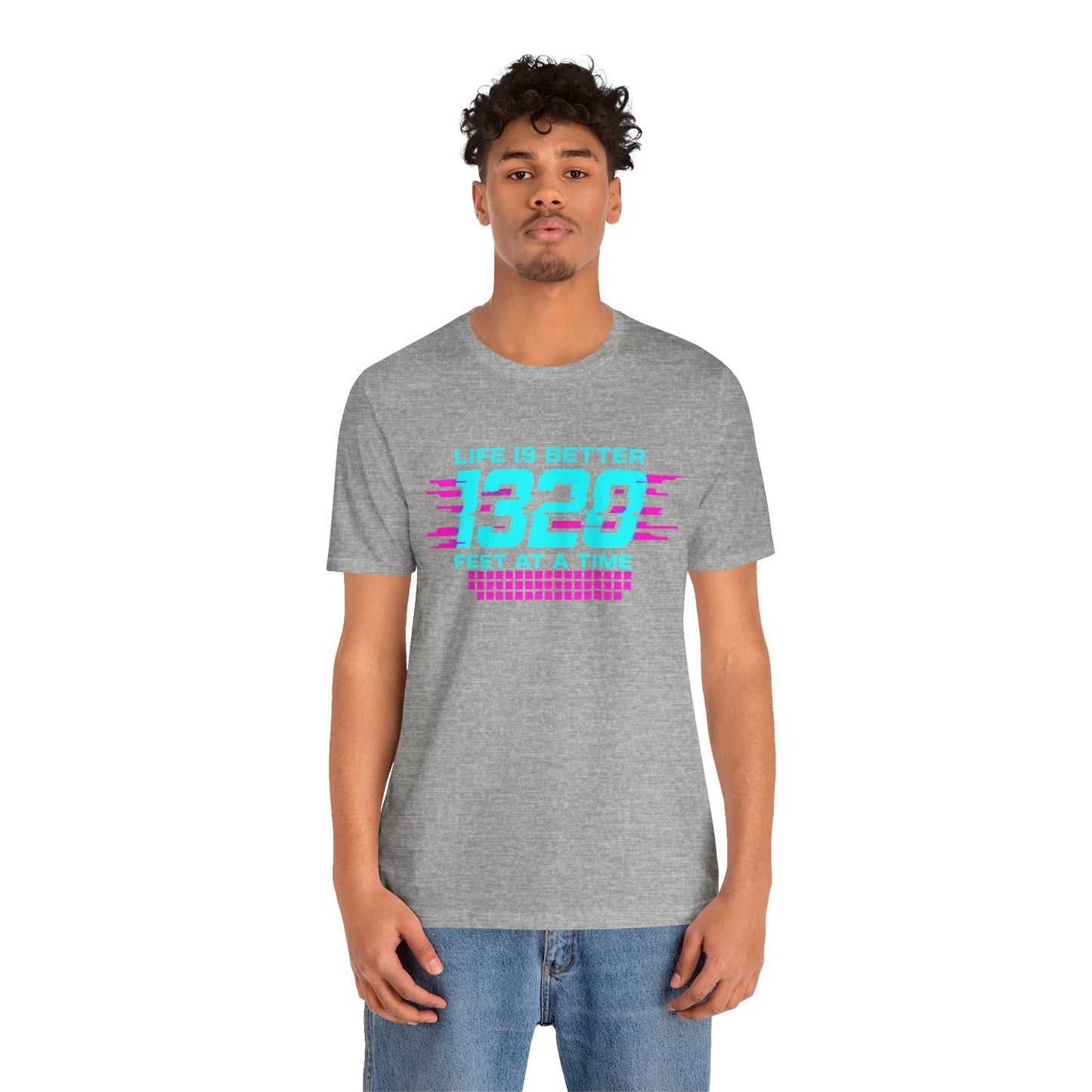 Person wearing a gray t-shirt with colorful text 'Life is better 1320 feet at a time' design on a white background