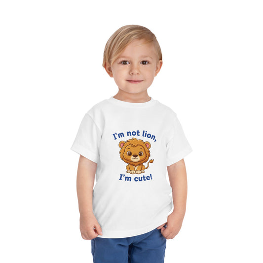 Child wearing a white t-shirt with a lion graphic and text "I'm Not Lion I'm Cute"  Bella+Canvas 3001T on a white background