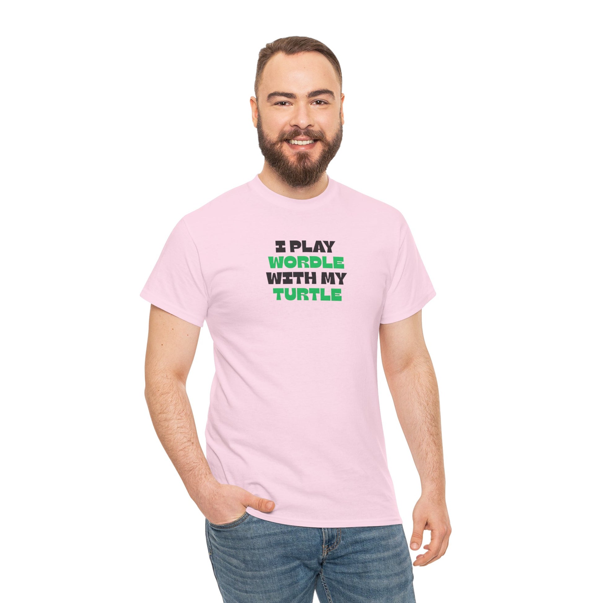 Man wearing a pink t-shirt with text 'I play wordle with my turtle' on a white background