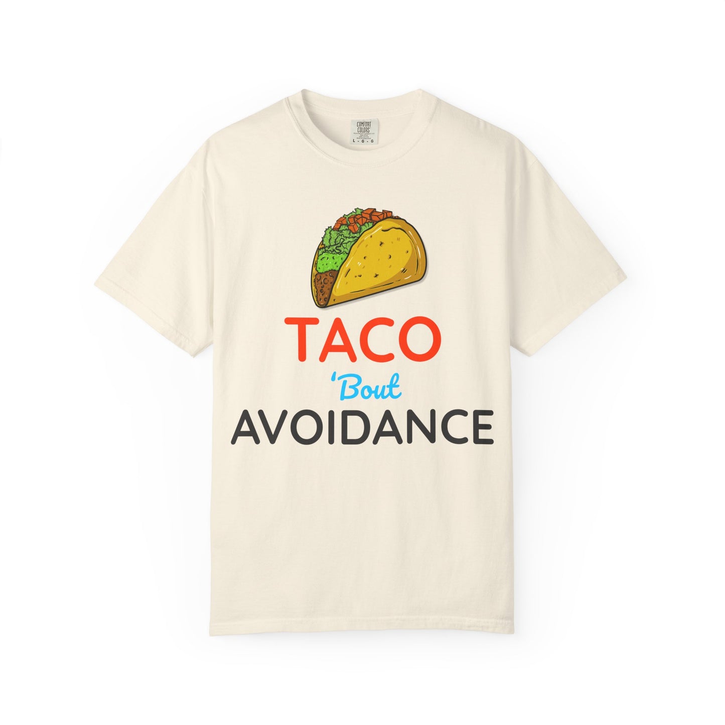 Beige t-shirt with a taco graphic and text 'Taco 'bout avoidance' on a white background