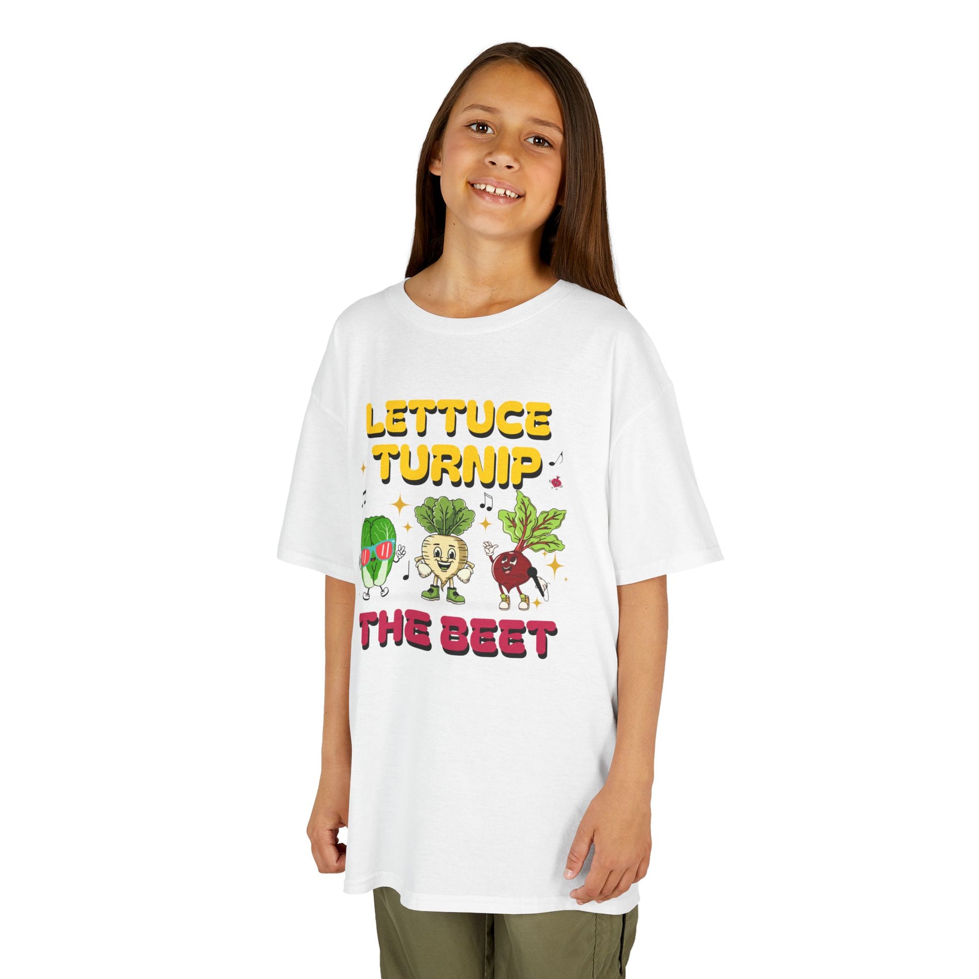 Child wearing a white t-shirt with colorful vegetable graphics and text 'Lettuce Turnip the Beet' on a white background