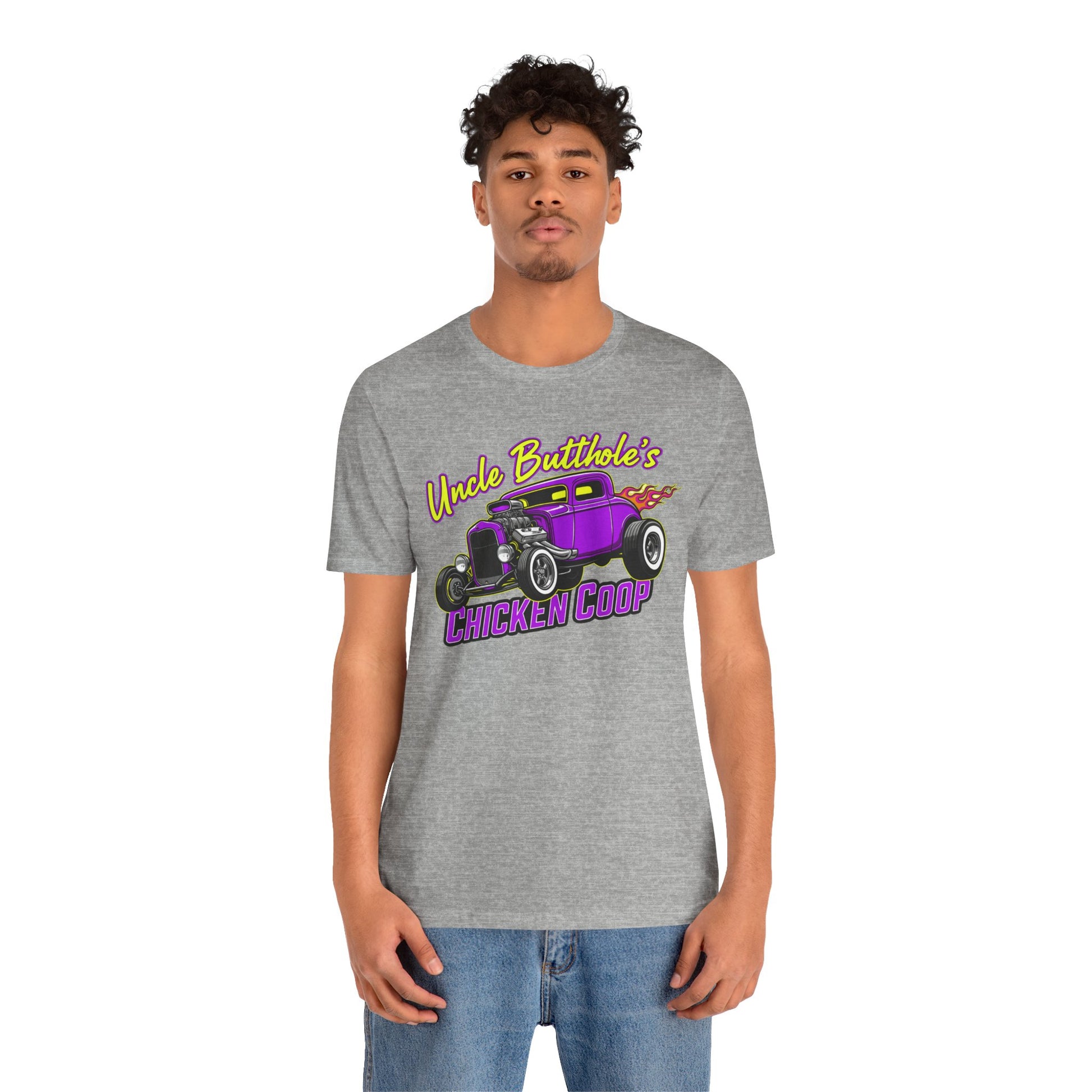 Man wearing a grey Bella+Canvas 3001 t-shirt with purple hot rod graphic and text 'Uncle Butthole's Chicken Coop' on a white background