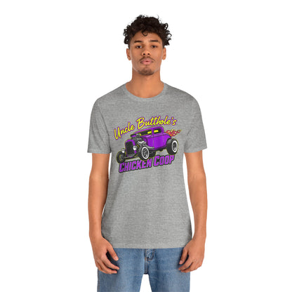 Man wearing a grey Bella+Canvas 3001 t-shirt with purple hot rod graphic and text 'Uncle Butthole's Chicken Coop' on a white background
