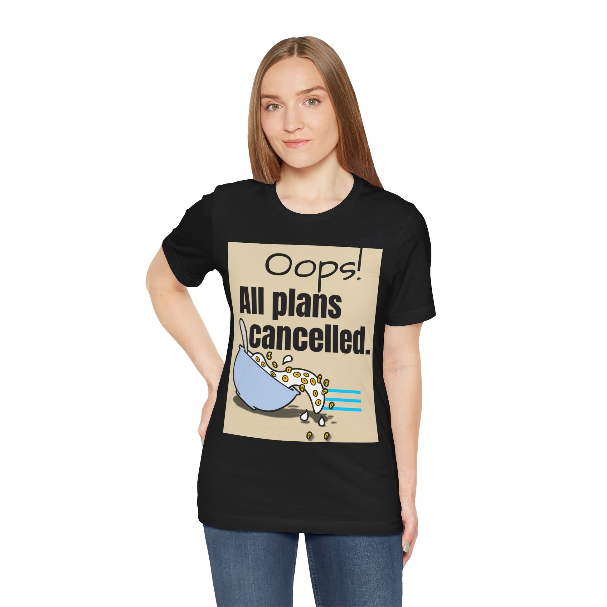 Person wearing a black t-shirt with a graphic and text 'Oops! All plans Cancelled.'