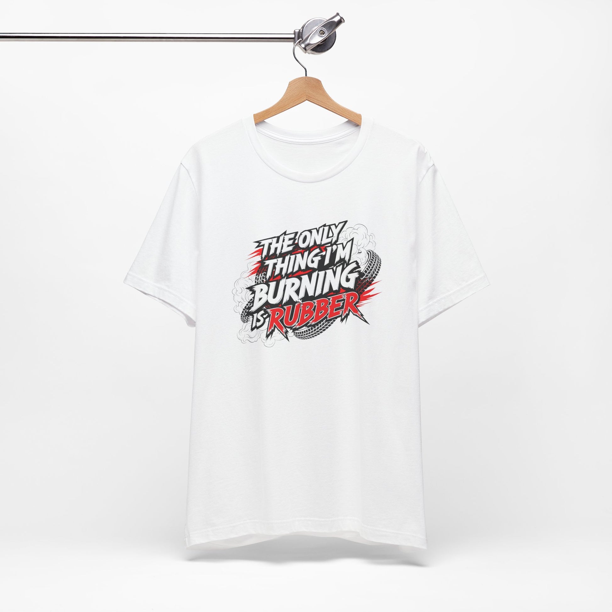 White t-shirt with graphic design and text 'The only thing I'm burning is rubber' on a white background
